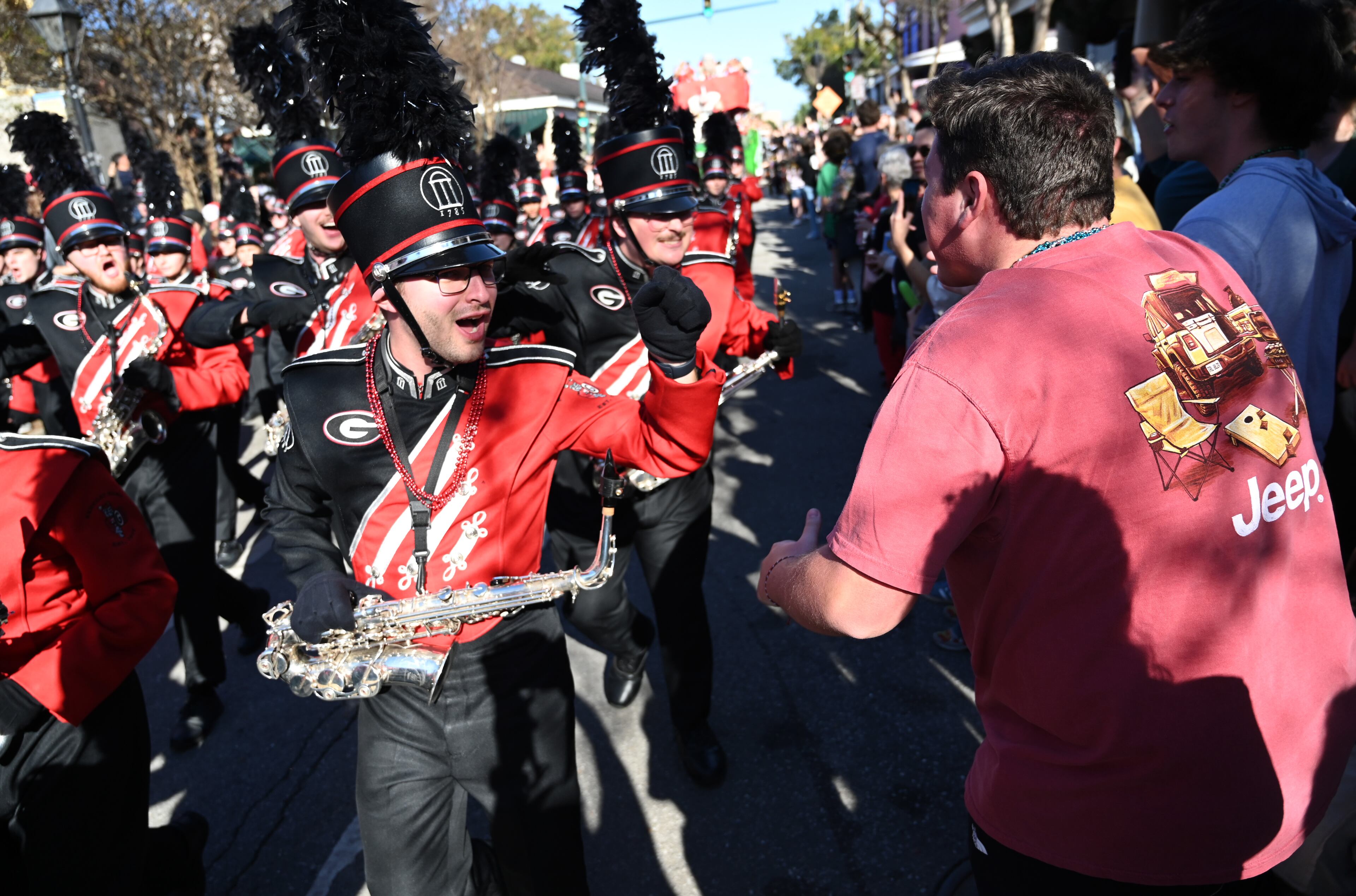 Georgia fans cheer as the Georgia float travels down Decatur Street during the Allstate Sugar Bowl New Year’s Eve Parade, Tuesday, December 31, 2024, in New Orleans, LA. (Hyosub Shin / AJC)