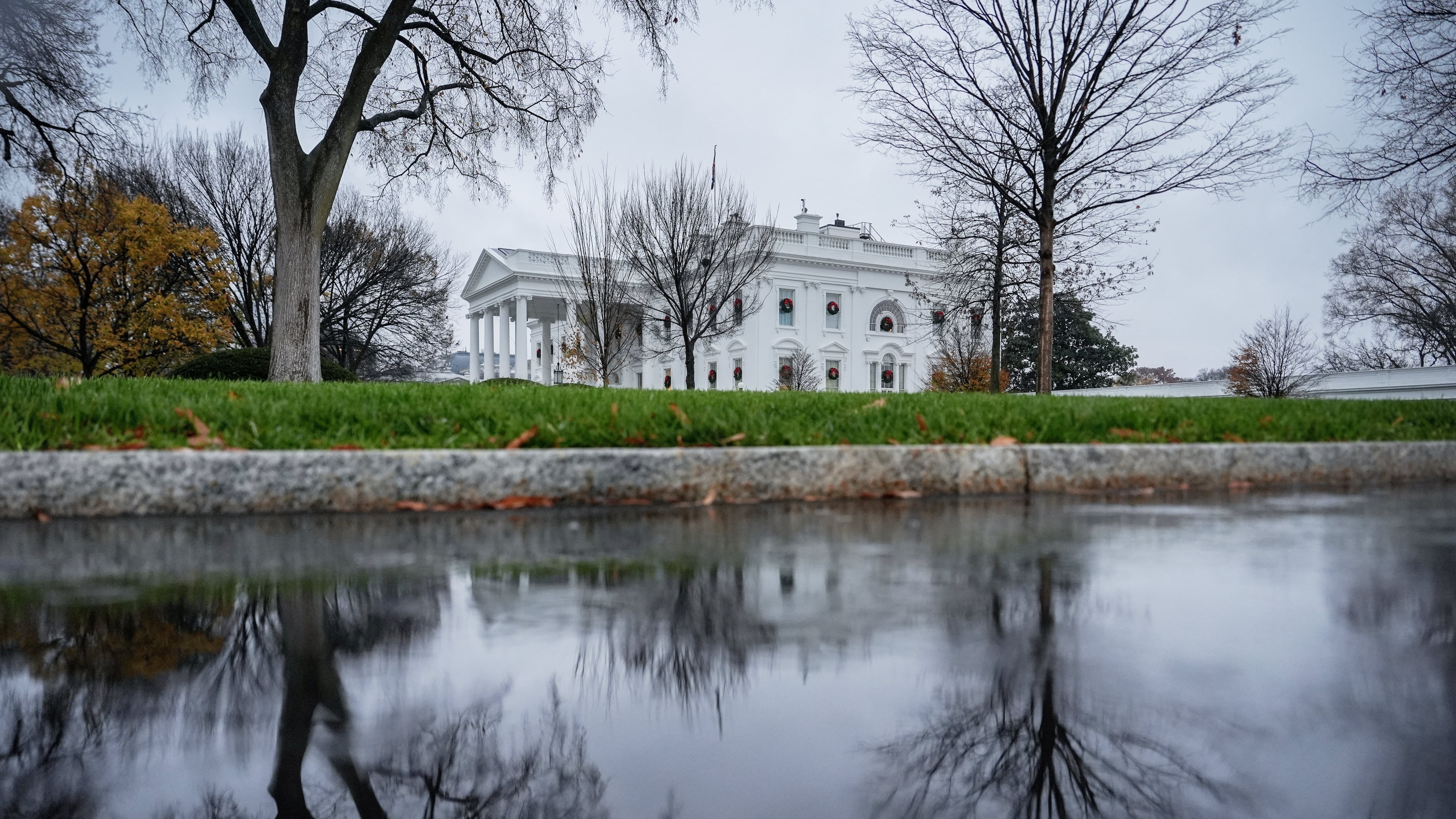 FILE - The White House is reflected in a puddle, Dec. 2, 2025, in Washington. (AP Photo/Julia Demaree Nikhinson, File)