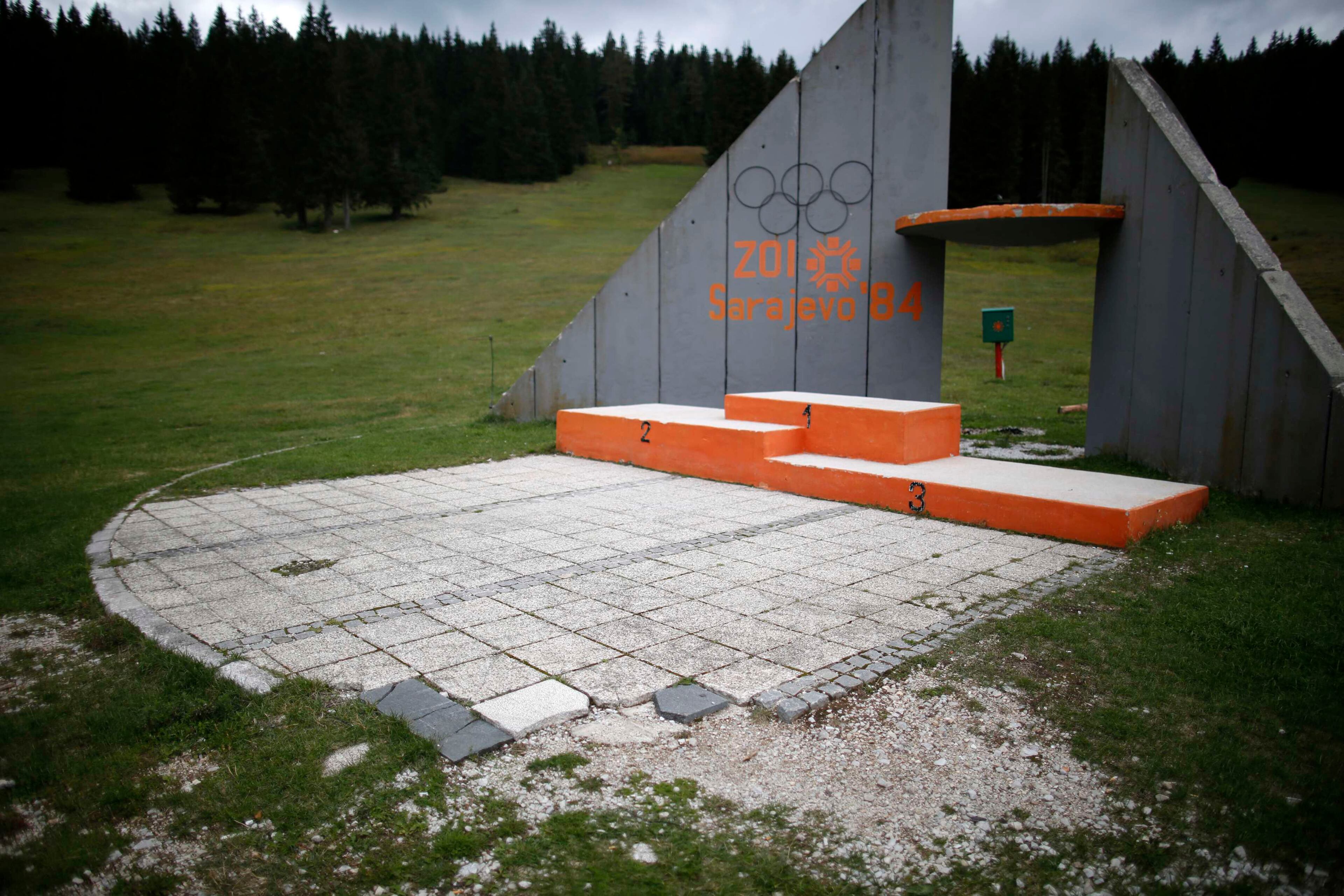 A view of the derelict medals podium at the disused ski jump from the Sarajevo 1984 Winter Olympics on Mount Igman, near Saravejo September 19, 2013. Abandoned and left to crumble into oblivion, most of the 1984 Winter Olympic venues in Bosnia's capital Sarajavo have been reduced to rubble by neglect as much as the 1990s conflict that tore apart the former Yugoslavia. The bobsleigh and luge track at Mount Trebevic, the Mount Igman ski jumping course and accompanying objects are now decomposing into obscurity. The bobsleigh and luge track, which was also used for World Cup competitions after the Olympics, became a Bosnian-Serb artillery stronghold during the war and is nowadays a target of frequent vandalism. The clock is now ticking towards the 2014 Winter Olympics, with October 29 marking 100 days to the opening of the Games in the Russian city of Sochi. Picture taken on September 19, 2013. REUTERS/Dado Ruvic