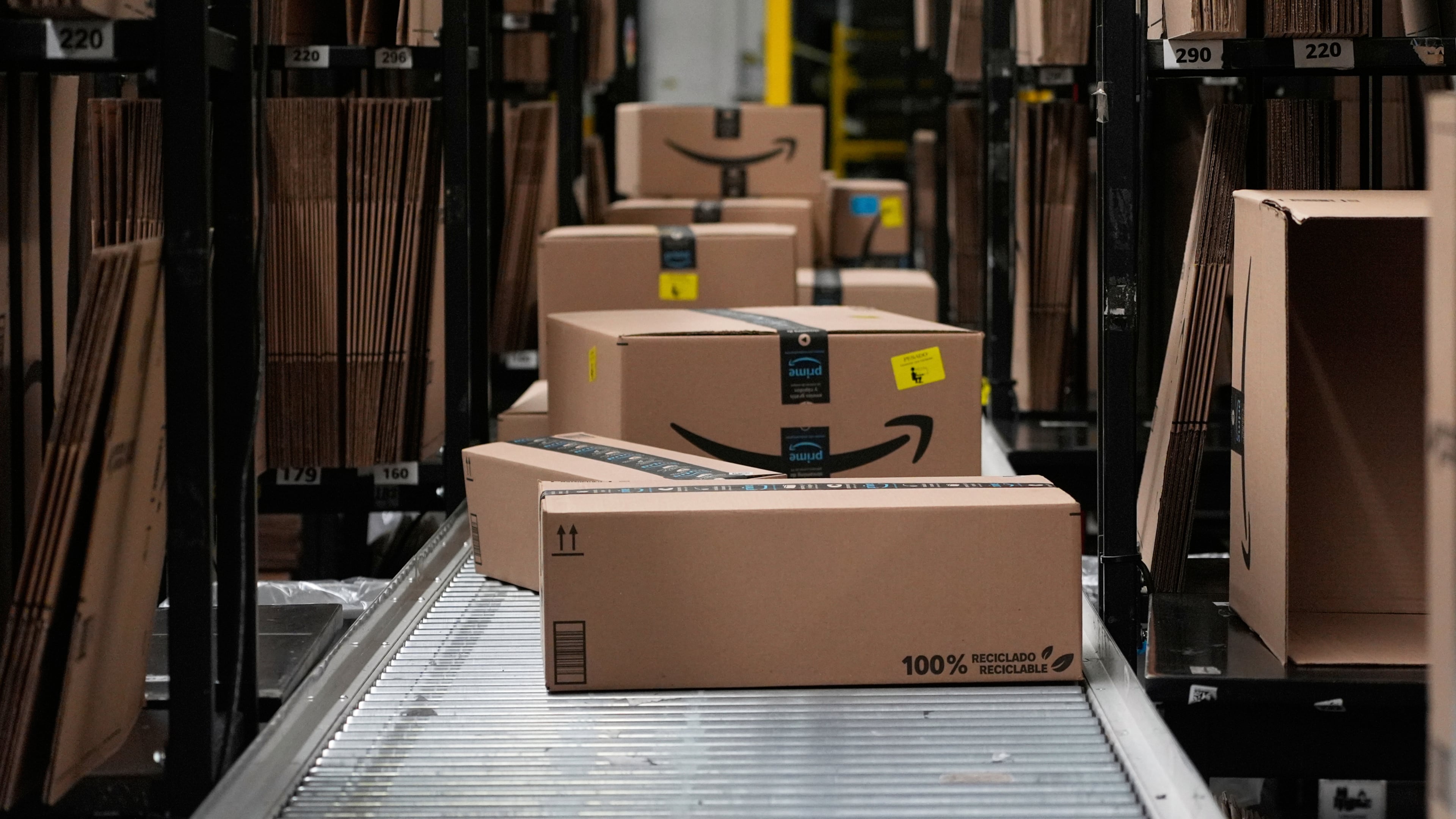 FILE - Boxes sit on a conveyor belt at an Amazon storage warehouse in Tepotzotlan, Mexico, May 22, 2025. (AP Photo/Marco Ugarte, File)