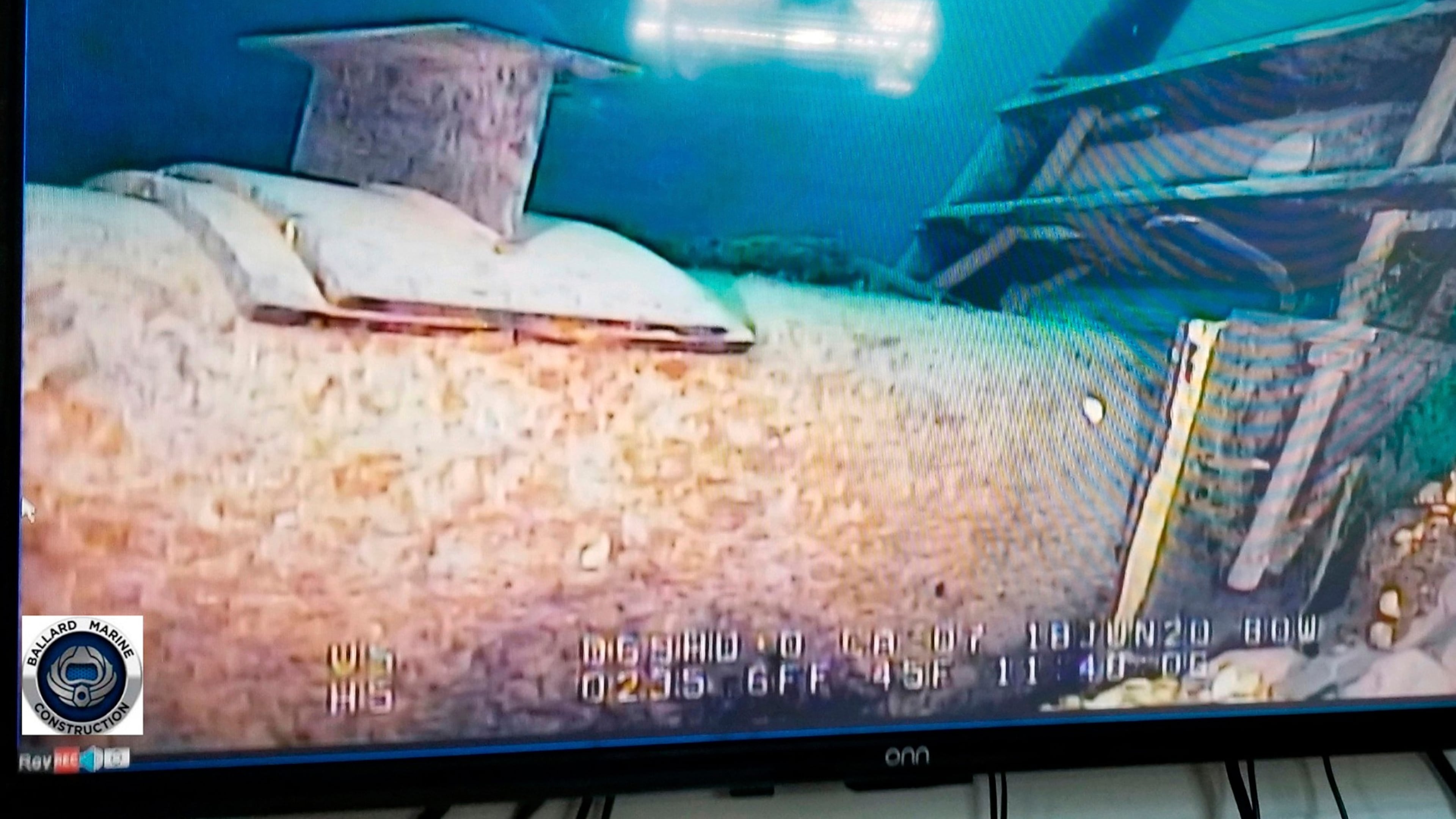 FILE - This photo provided by the Michigan Department of Environment, Great Lakes, and Energy in June 2020 shows damage to anchor support EP-17-1 on the east leg of the Enbridge Line 5 pipeline in the Straits of Mackinac in Michigan, displayed on a television screen. (Michigan Department of Environment, Great Lakes, and Energy via AP, File)