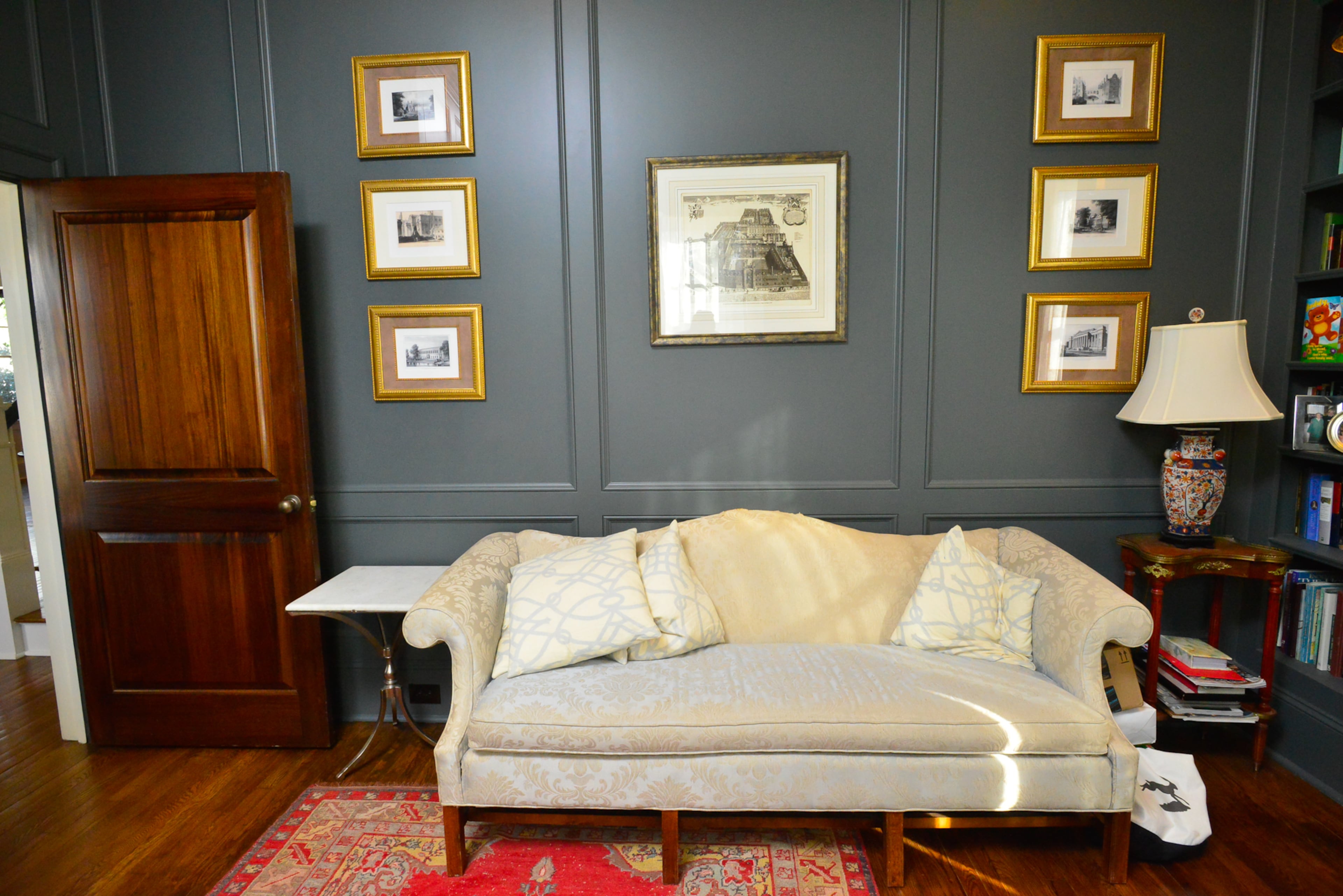 The Grahams wanted a door to the office, and found this one at a Habitat for Humanity ReStore. They had to restore, polish and stain the door, and the dark paneled office provides a contrast from what Laura describes as the crisp, white home.
