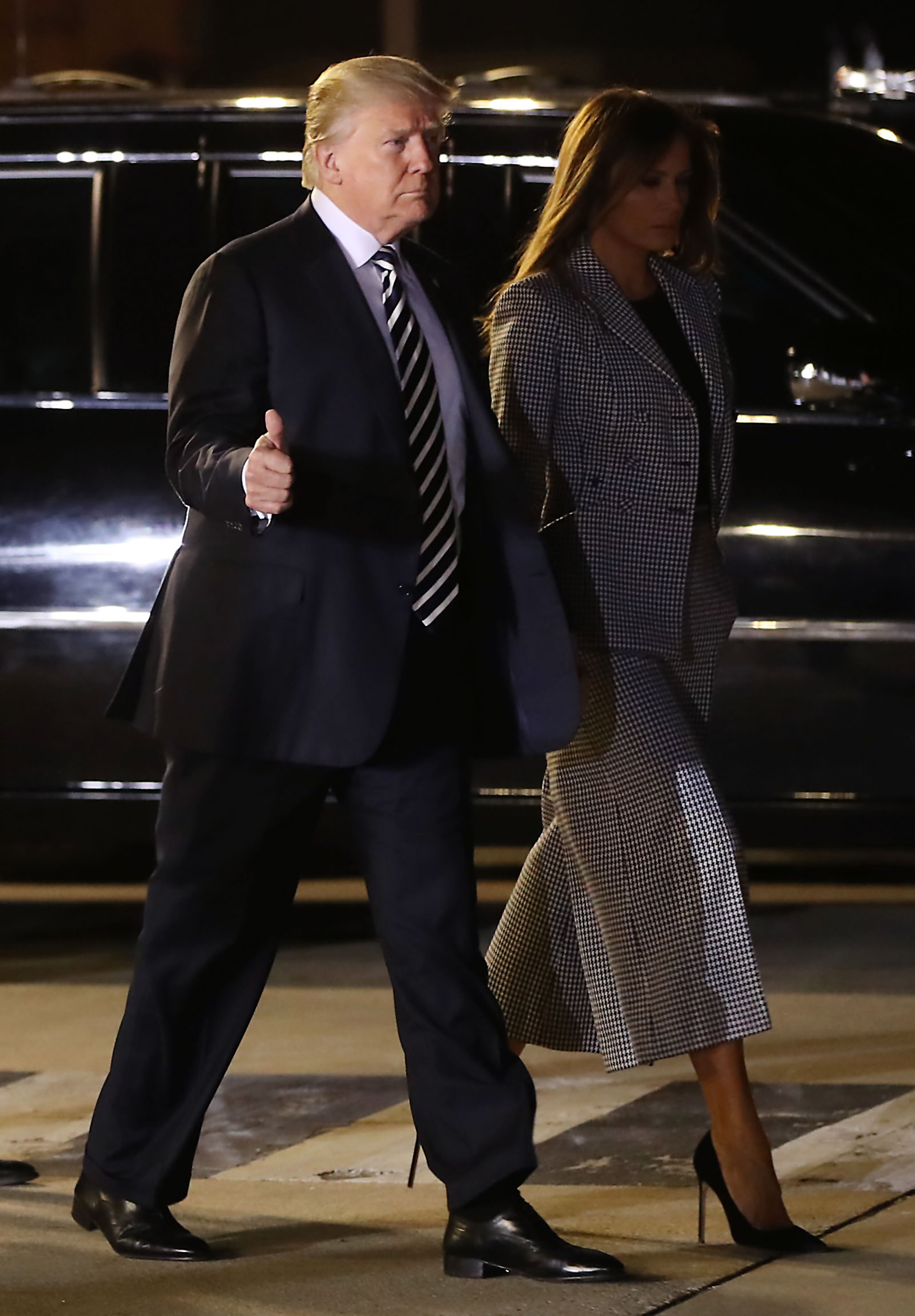 President Donald Trump and First Lady, Melania Trump walk to greet the three Americans just released from North Korea, Kim Dong Chul, Kim Hak-song and Tony Kim, on May 9, 2018 in Maryland.