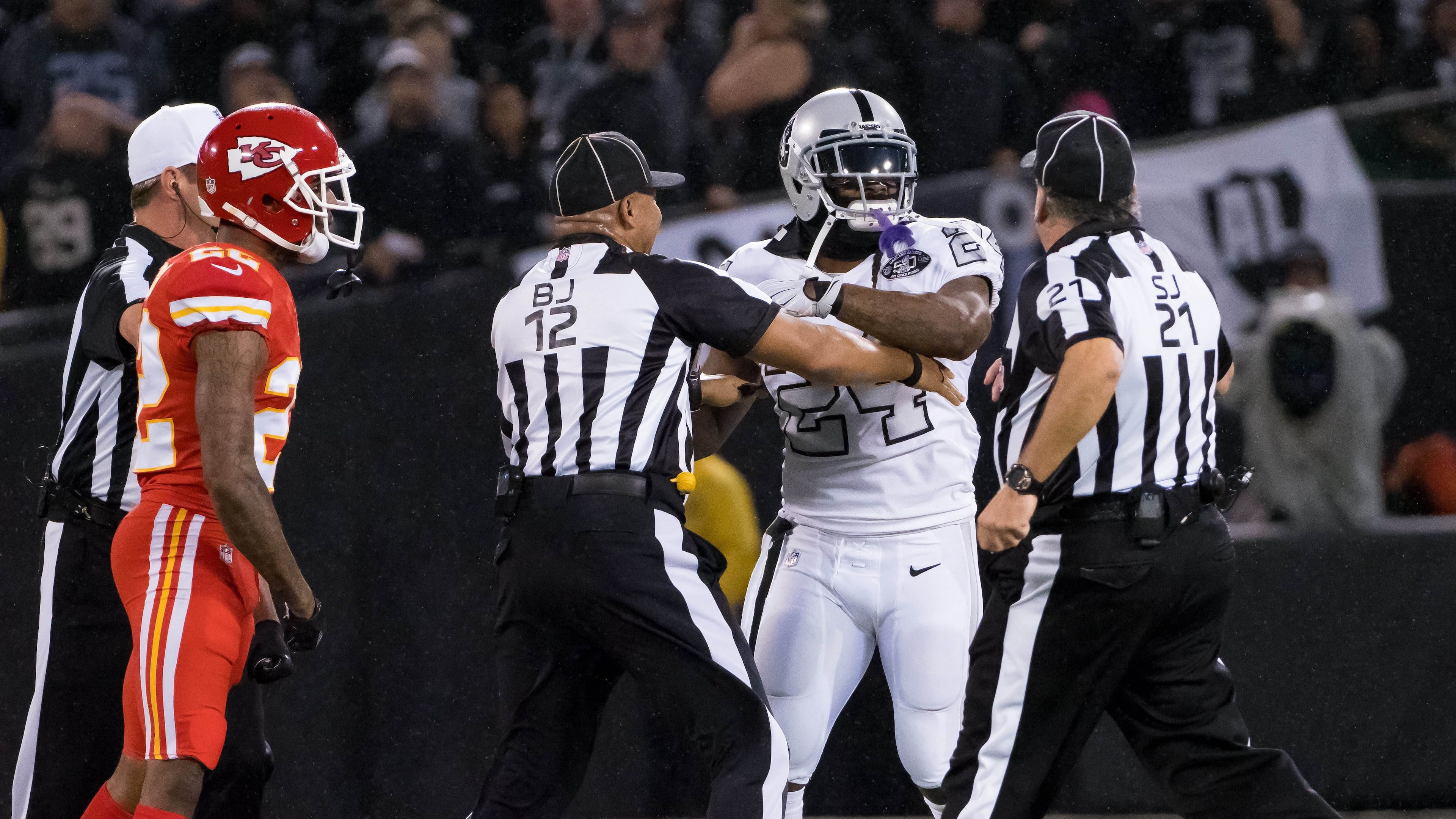 Oakland Raiders running back Marshawn Lynch (24) in an altercation with the referees during the second quarter against the Kansas City Chiefs at Oakland Coliseum.