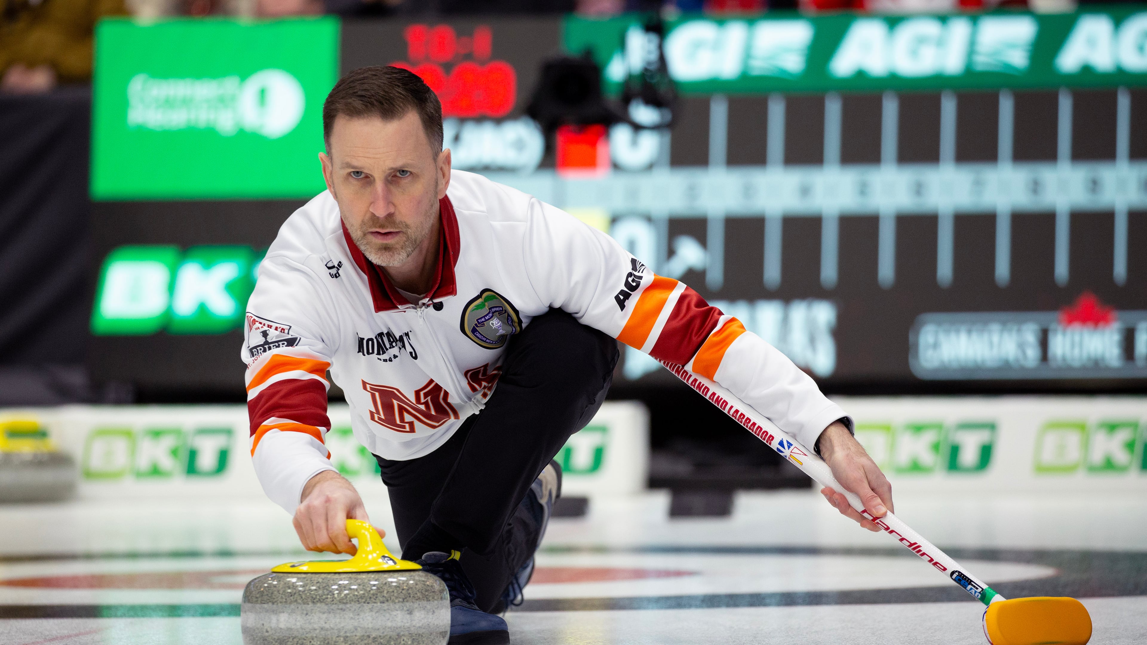 FILE - Brad Gushue, skip of Team Newfoundland and Labrador-Gushue, delivers his stone during Draw 17 at the Montana's Brier Canadian men's curling championship in St. John's, N.L., March 5, 2026. (Paul Daly/The Canadian Press via AP, File)