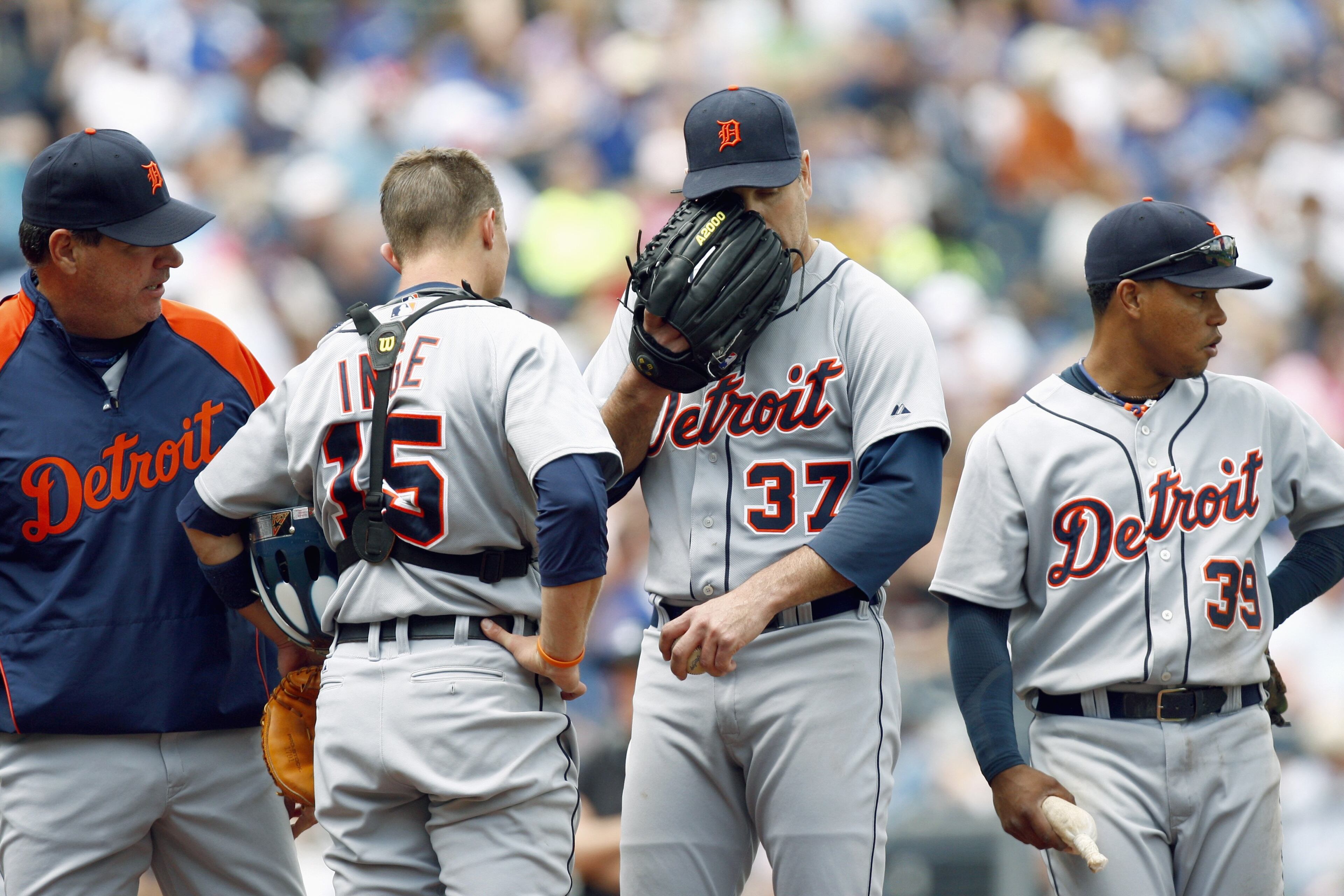KANSAS CITY, MO - MAY 15: Pitching coach Chuck Hernandez #55 of the Detroit Tigers talks with Kenny Rogers #37, Brandon Inge #15 and Ramon Santiago #39 o the mound against the Kansas City Royals on May 15, 2008 at Kauffman Stadium in Kansas City, Missouri. (Photo by G. Newman Lowrance/Getty Images)