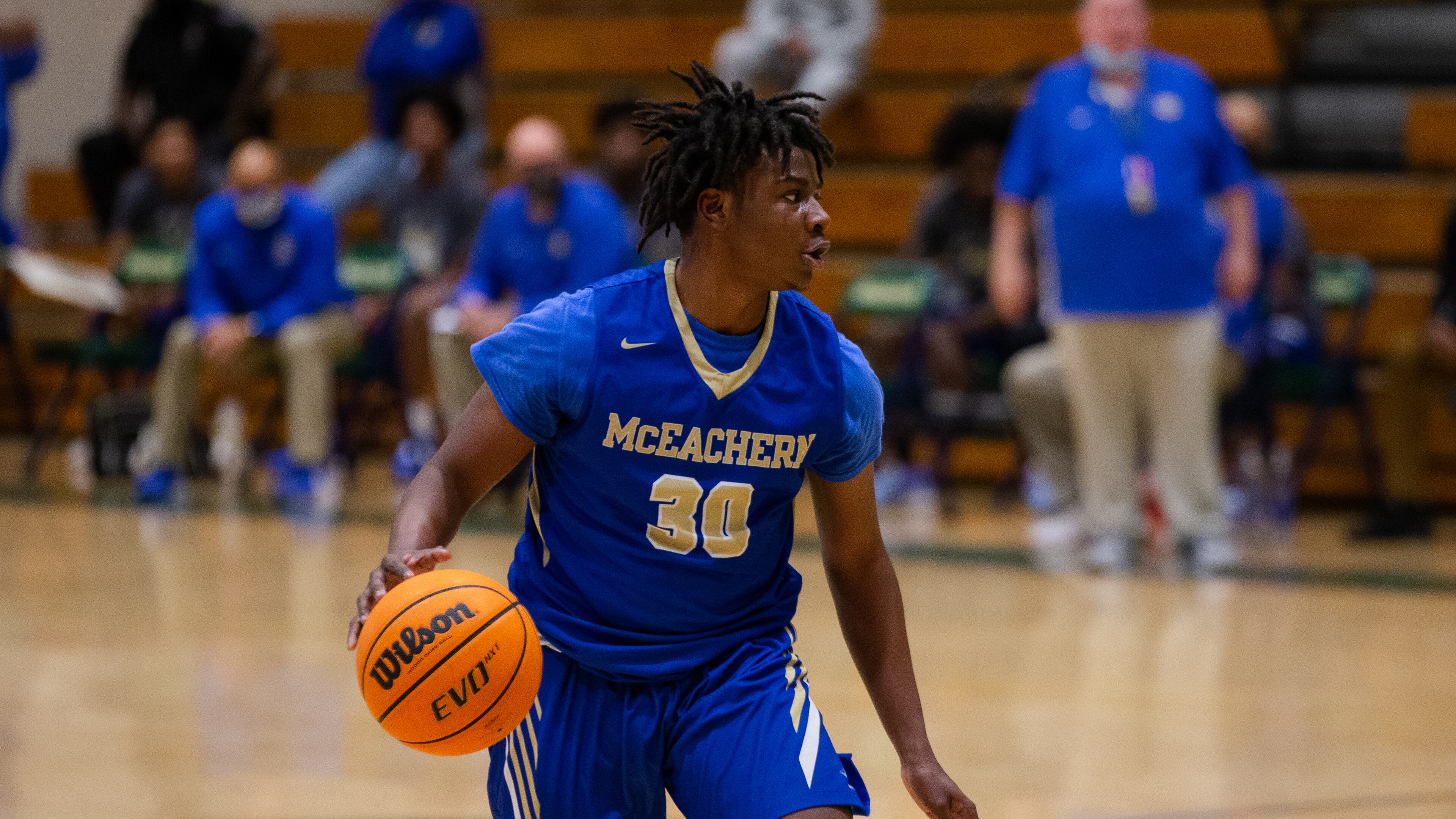 Mike Jacobs (30), guard for McEachern, dribbles down the court during the Grayson vs. McEachern high school boys basketball playoff game on Saturday, February 27, 2021, at Grayson High School in Loganville, Georgia. McEachern defeated Grayson 57-56 in overtime. CHRISTINA MATACOTTA FOR THE ATLANTA JOURNAL-CONSTITUTION
