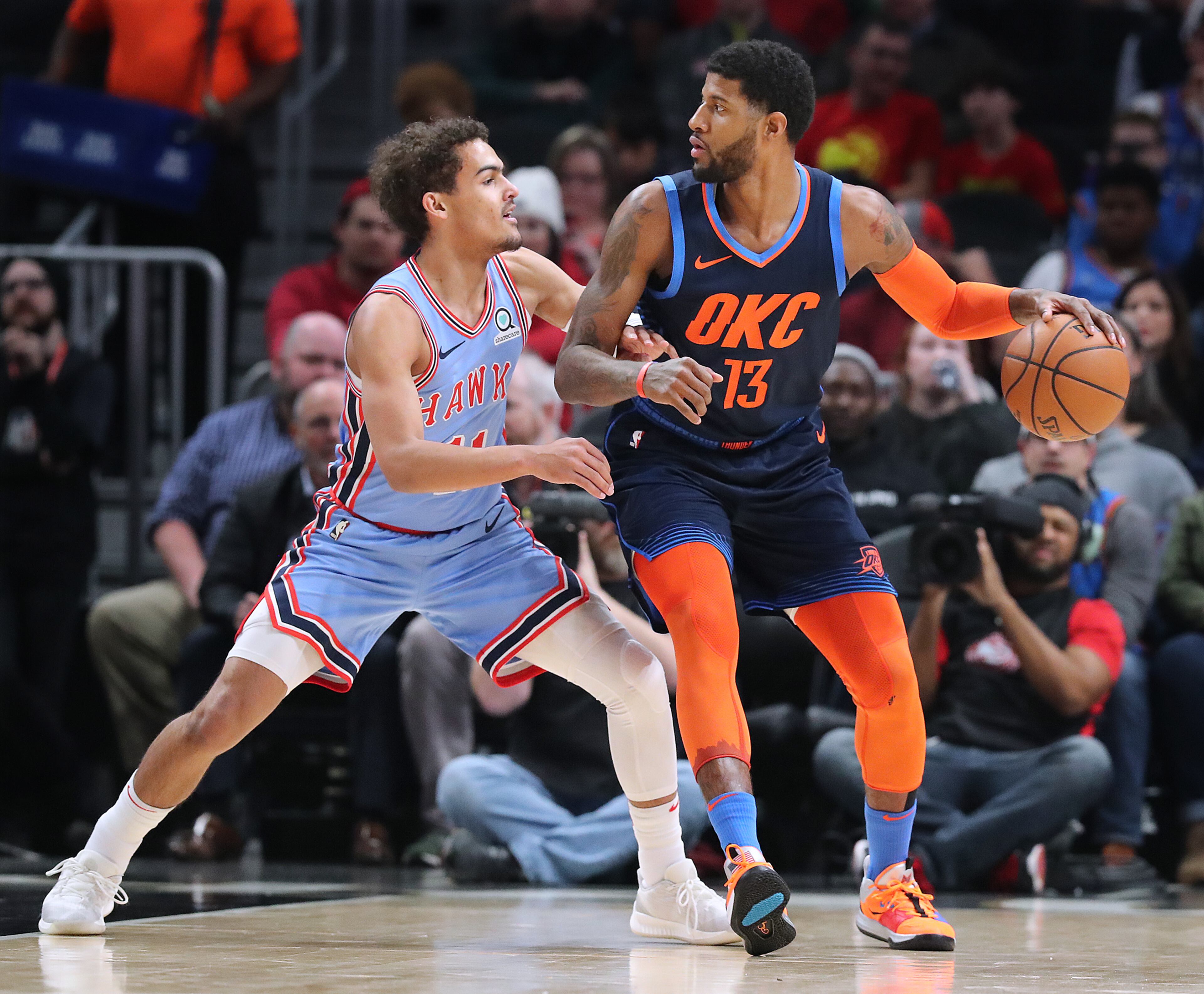 Jan. 15, 2019 Atlanta: Atlanta Hawks guard Trae Young defends against Oklahoma City Thunder forward Paul George during the first half in a NBA basketball game on Tuesday, Jan. 15, 2019, at State Farm Arena in Atlanta. Curtis Compton/ccompton@ajc.com