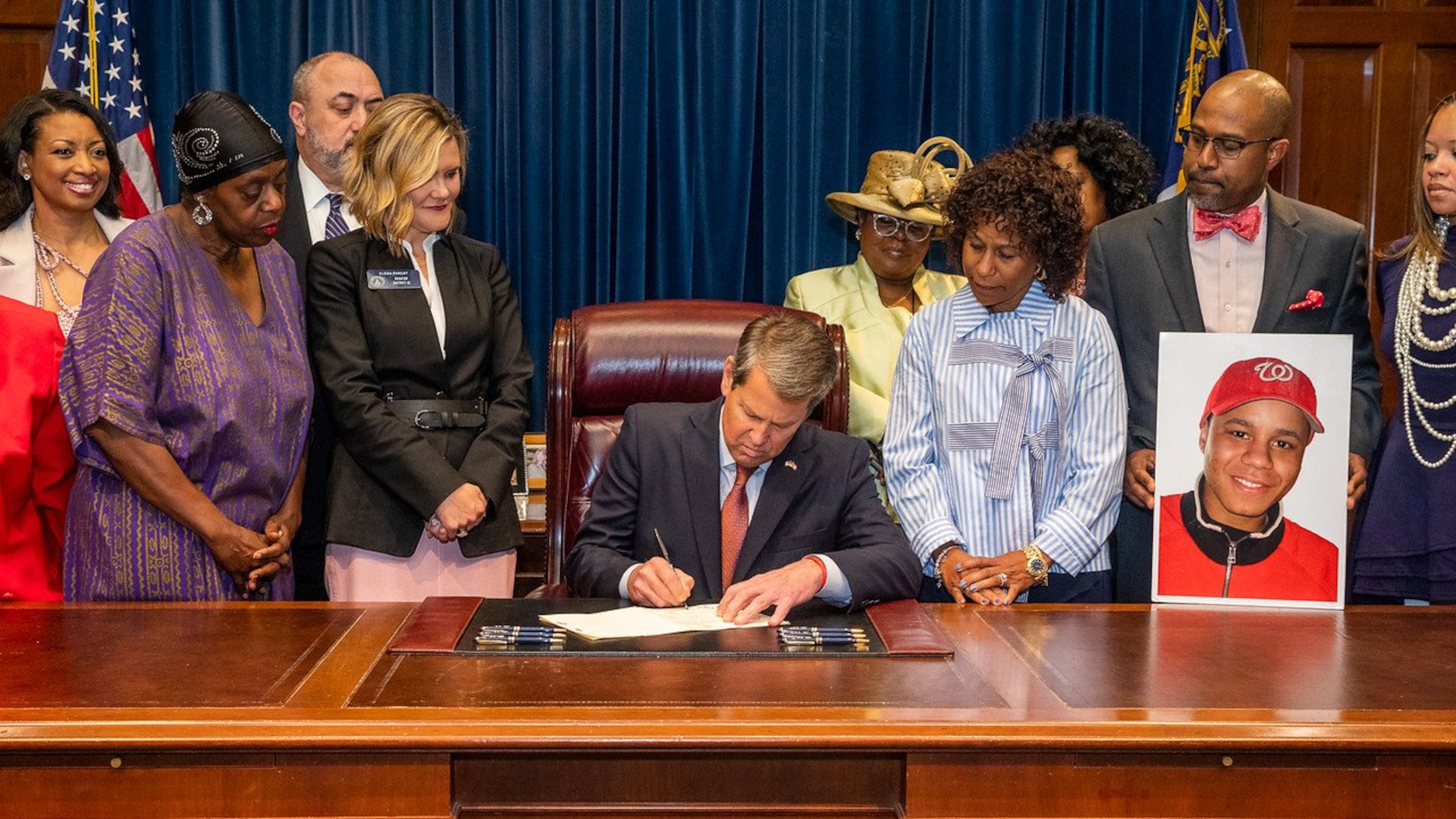 Gov. Brian Kemp, pictured here signing a bill into law earlier, on Friday vetoed a bill DeKalb County Schools wanted that would have addressed some effects of future annexations on the school district.