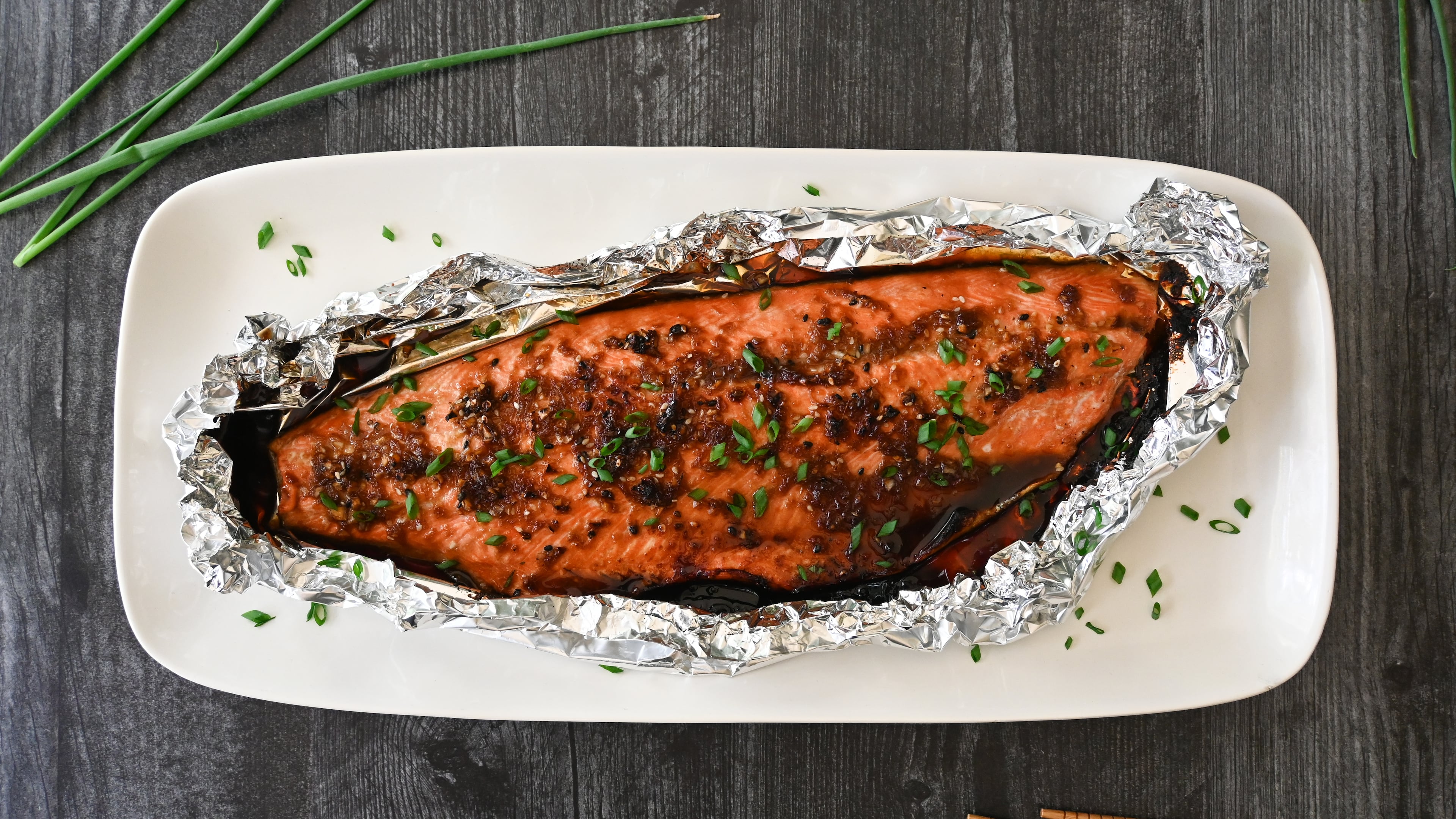 This salmon recipe uses soy, ginger and scallion to cut the fishiness while letting the fish retain its delicate flavors. (Candy Hom for the AJC)