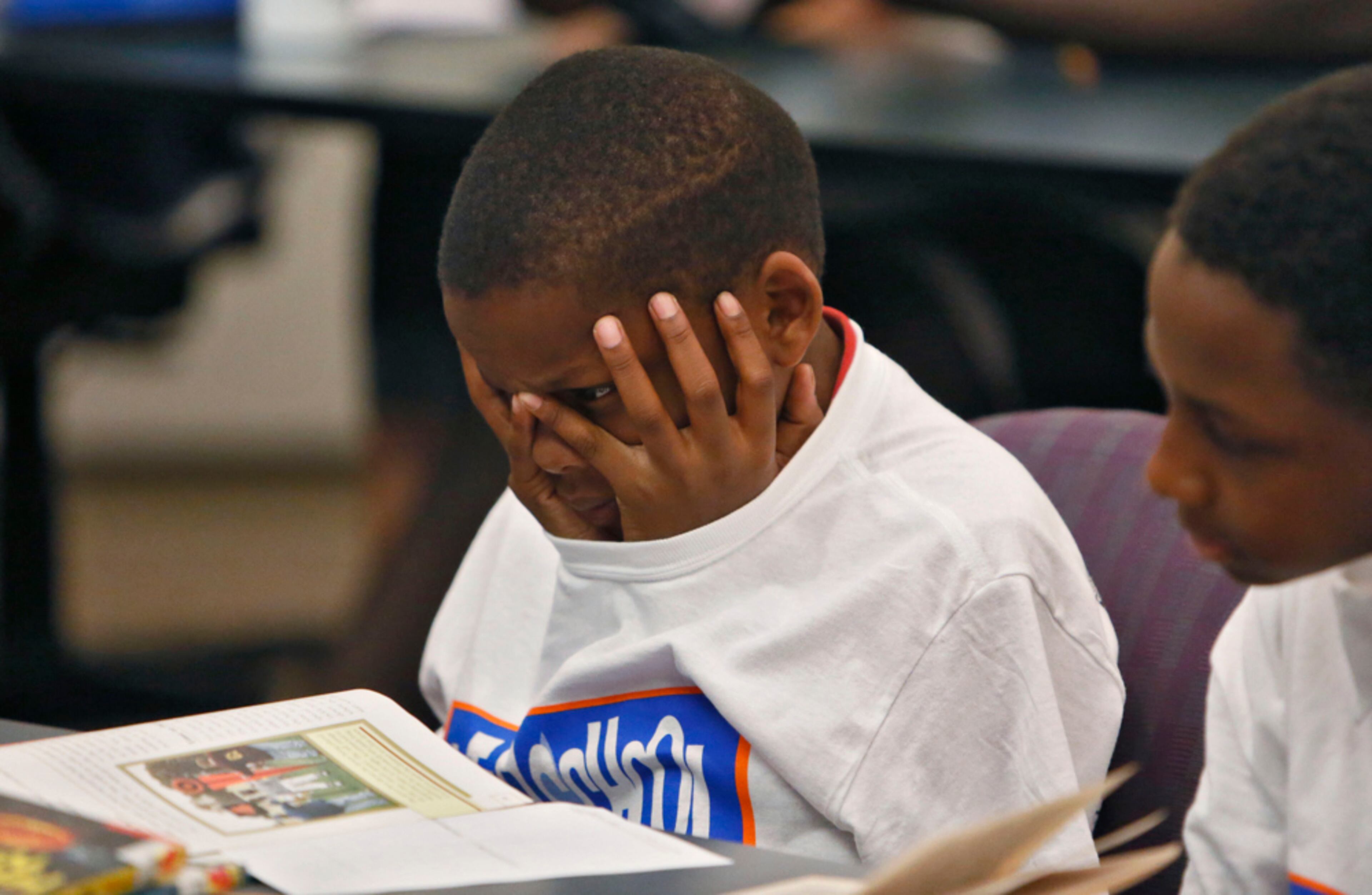 June 18, 2013 - Atlanta - Brandon Stokes, 11, is one of the students tutored in a GSU graduate level class that trains teachers to teach literacy. Georgia State Graduate students in education learn how to teach literacy by working with students from After School All Stars Atlanta after school program. Colleges in Georgia fared okay to not so great in the National Council on Teacher Quality report, which rates teacher preparation programs and concluded that �a vast majority of teacher preparation programs do not give aspiring teachers adequate return on their investment of time and tuition dollars.� BOB ANDRES / BANDRES@AJC.COM
