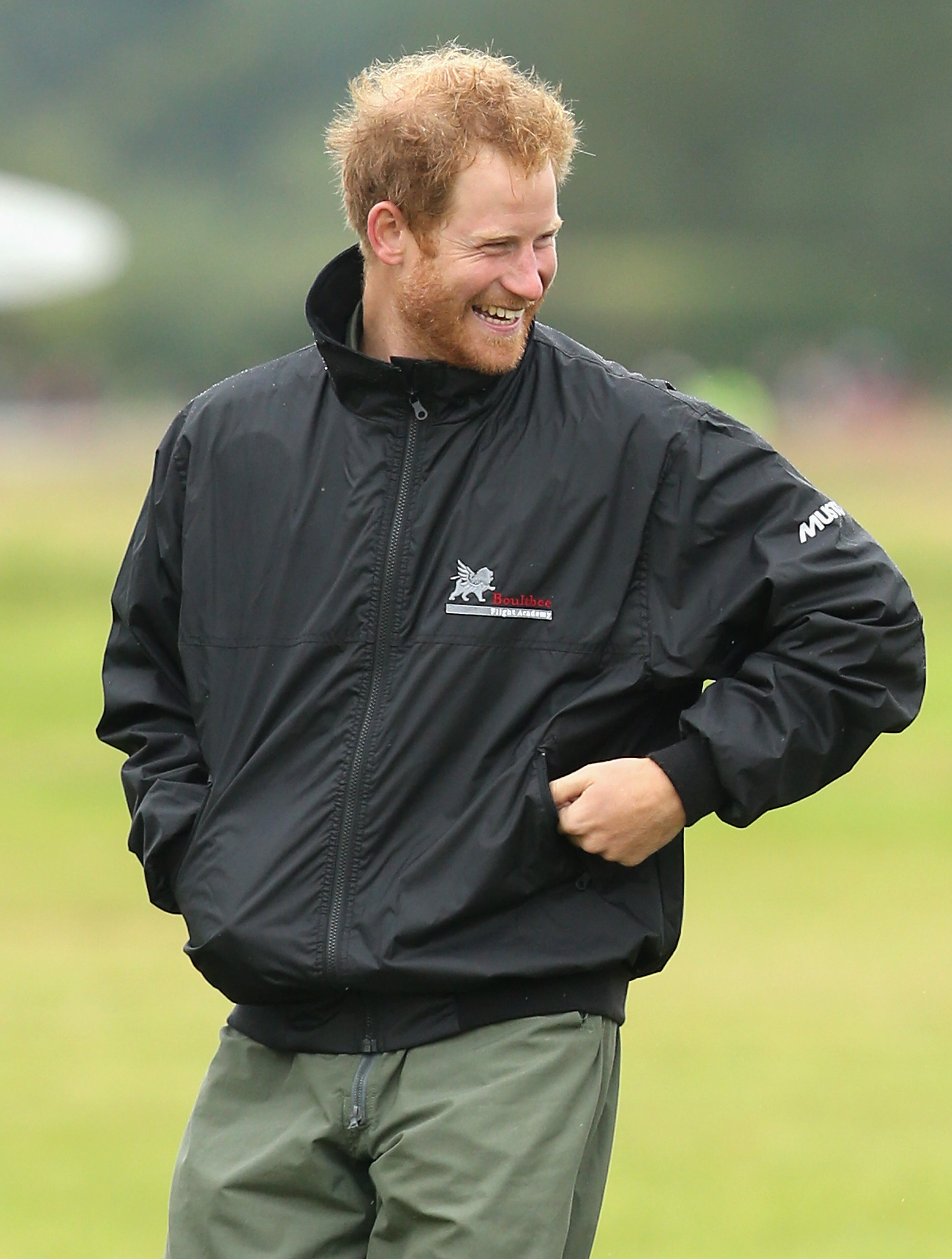 CHICHESTER, ENGLAND - SEPTEMBER 15: Prince Harry walks on the airfield at Goodwood Aerodrome as he is shown Spitfire Aircraft that will take place in a Battle of Britain Flypast at Goodwood on September 15, 2015 in Chichester, England. The 75th Anniversary of the Battle of Britain is being marked by a historic flypast that brings more Battle of Britain aircraft together than ever before as a show of thanks to 'the few' and the sacrifices they made. (Photo by Chris Jackson/Getty Images)