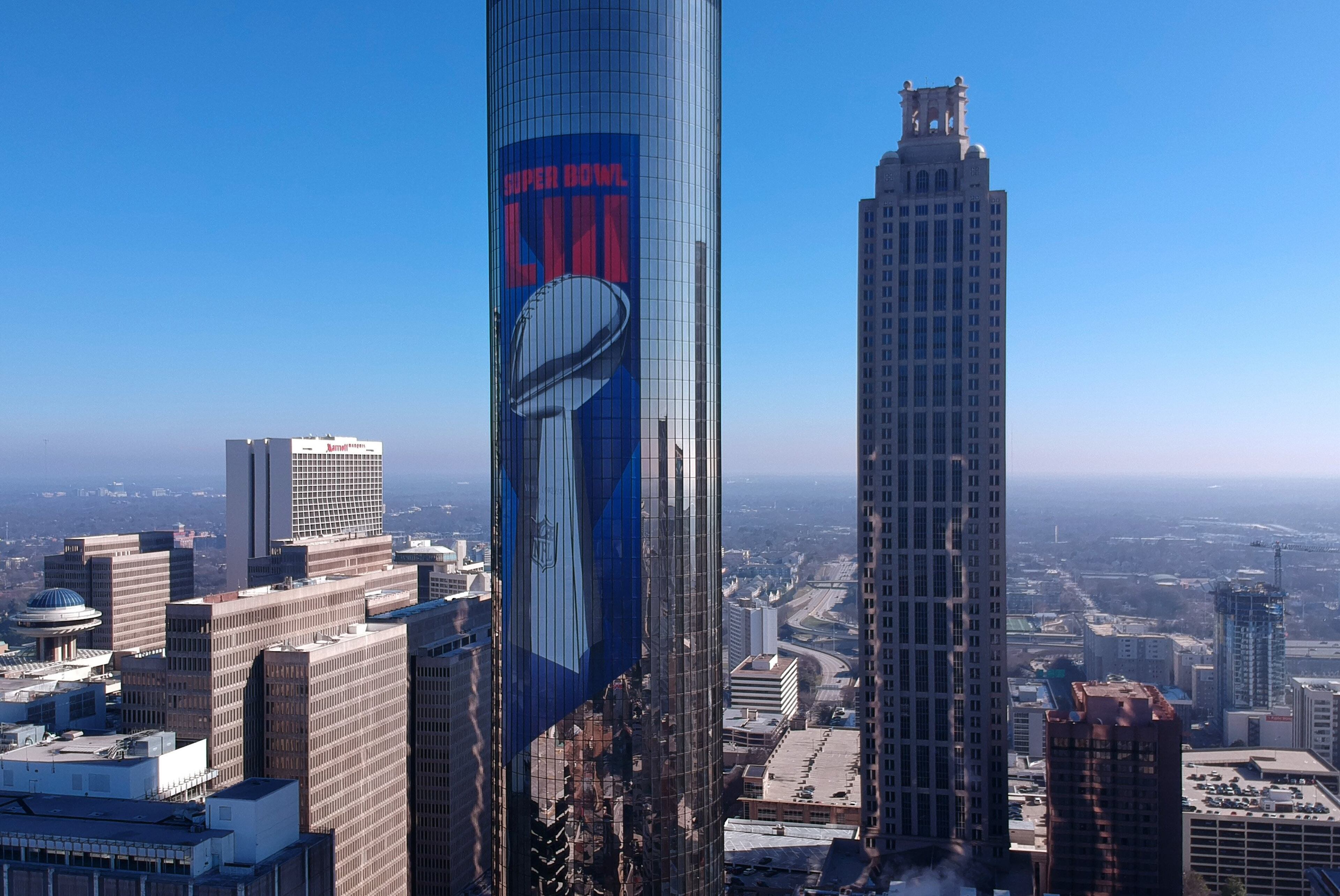 January 16, 2019 Atlanta - Arial photo of The Westin Peachtree Plaza with Super Bowl signage wrapped around the building in downtown Atlanta on Wednesday, January 16, 2019. Atlanta faces a test on Super Bowl Sunday and the question with less than a month to go before the big game is this: Is the city ready? The city budgeted some $10 million last year for police, fire and other items to assist with the big game. HYOSUB SHIN / HSHIN@AJC.COM