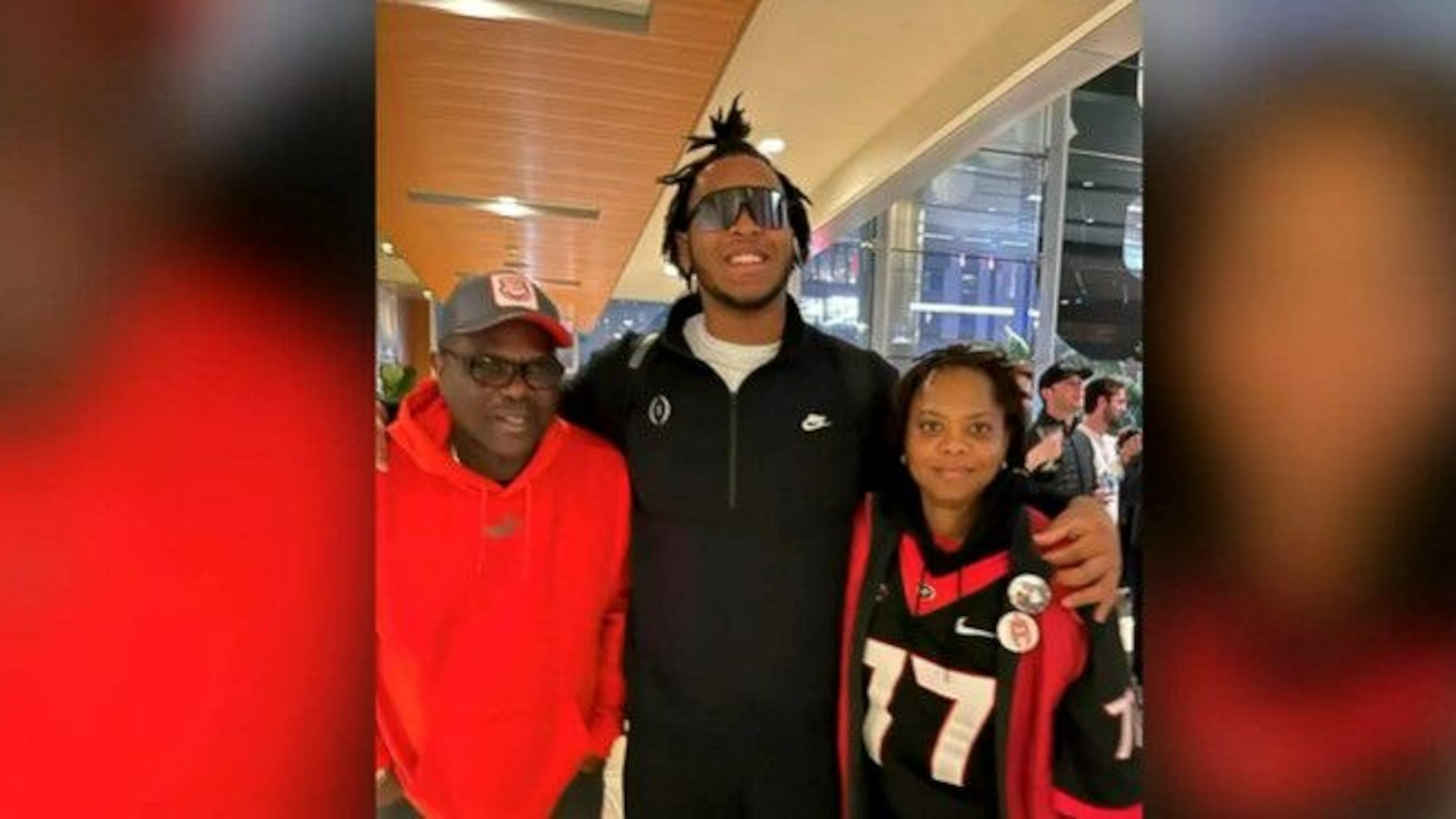 Devin Willock (center) with his parents, Dave and Sharlene Willock.