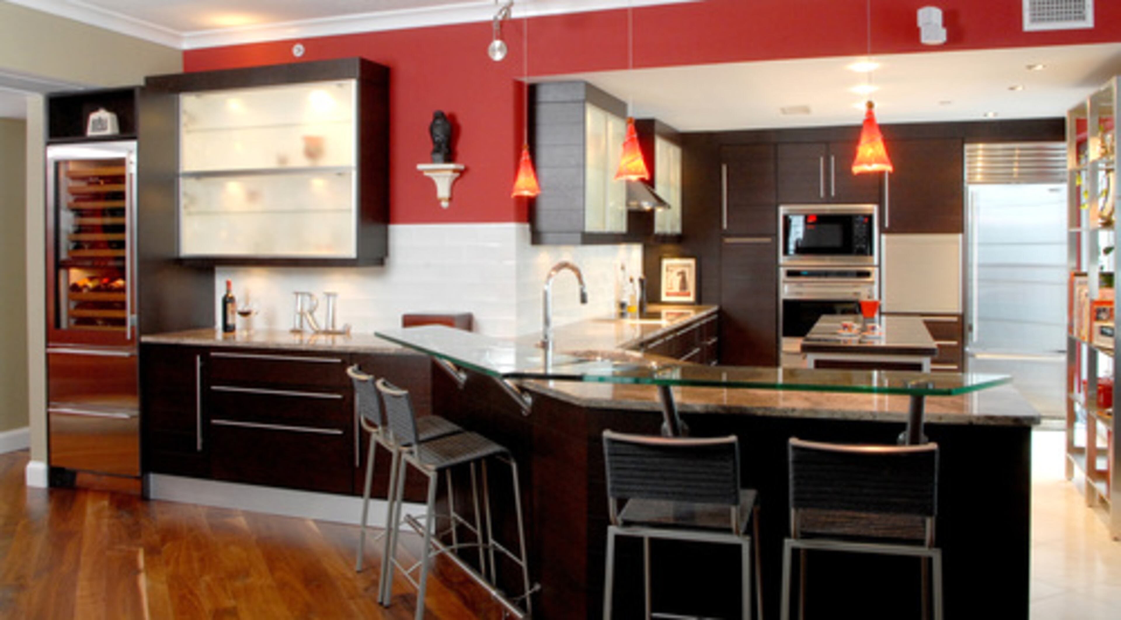 PROJECT GOAL: Lynda Burgess, a designer with the Atlanta branch of kitchen retailer Cucine LUBE, created this kitchen in the Mayfair Renaissance condo she shares with her fiance. The couple likes to stay in and cook, so her goal was to increase the style and functionality. "Now we seldom eat out," she said. BIGGEST SPLURGE: Appliances, which include a Wolf oven, warming drawer and microwave, as well as a Sub-Zero refrigerator and wine cooler. Retail cost -- about $20,000, she said.