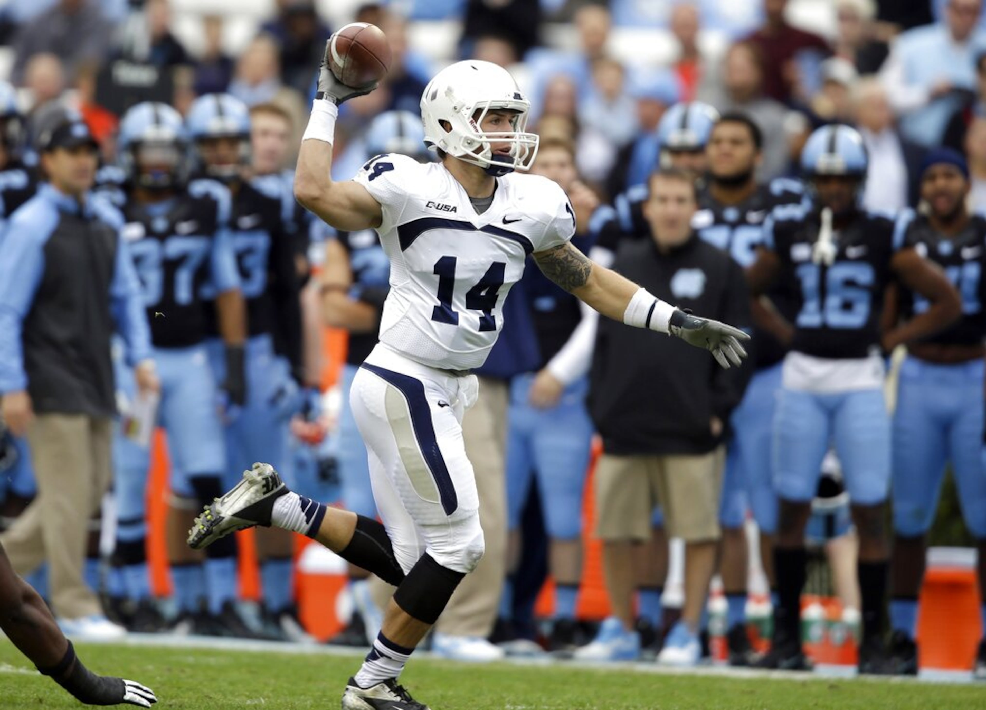 Old Dominion quarterback Taylor Heinicke looks to pass against North Carolina during the first half of an NCAA college football game in Chapel Hill, N.C., Saturday, Nov. 23, 2013. (AP Photo/Gerry Broome)