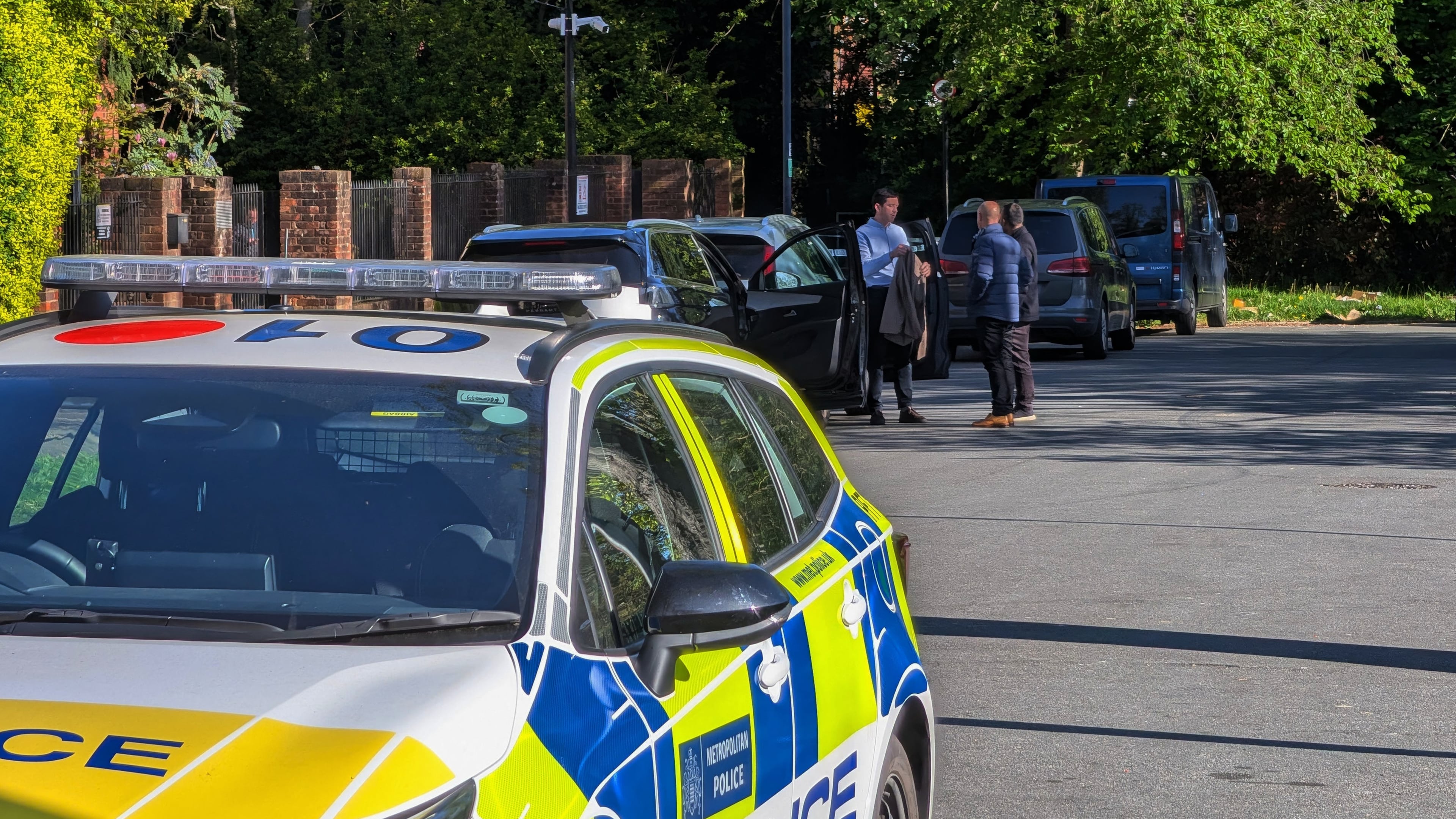 Police officers patrol at a cordon near Kenton United Synagogue in Harrow, a suburb of London, Sunday, April 19, 2026. (Jamie Lashmar/PA via AP)