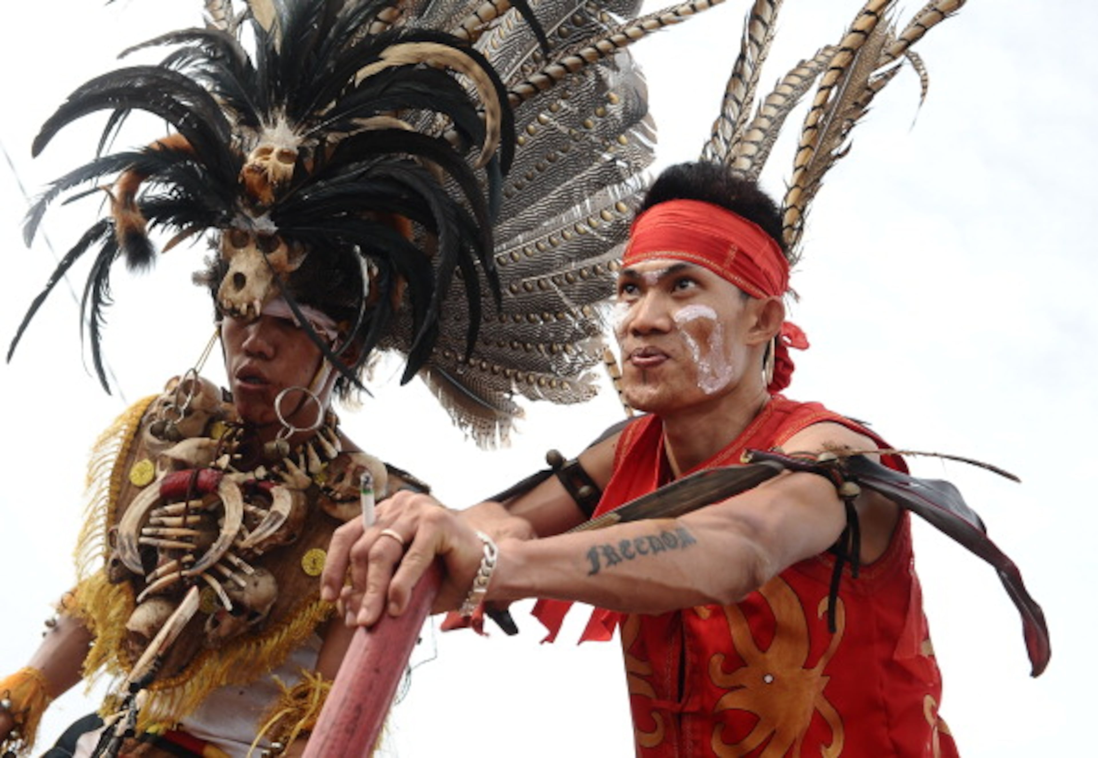 SINGKAWANG, KALIMANTAN, INDONESIA - FEBRUARY 14: A Tatung performs an action during Tatung Festival as part of Cap Go Meh celebration on February 14, 2014 in Singkawang, Kalimantan, Indonesia. The ancient art of Tatung, performed as part of the Cap Go Meh Festival, is believed to call upon positive spirit who help to dispel the bad spirits that may affect people's lives. Cap Go Meh Festival also know as Lantern Festival is celebrated in the 15th day of Chinese Lunar Year and marks the end of the Chinese New Year celebrations. (Photo by Robertus Pudyanto/Getty Images)