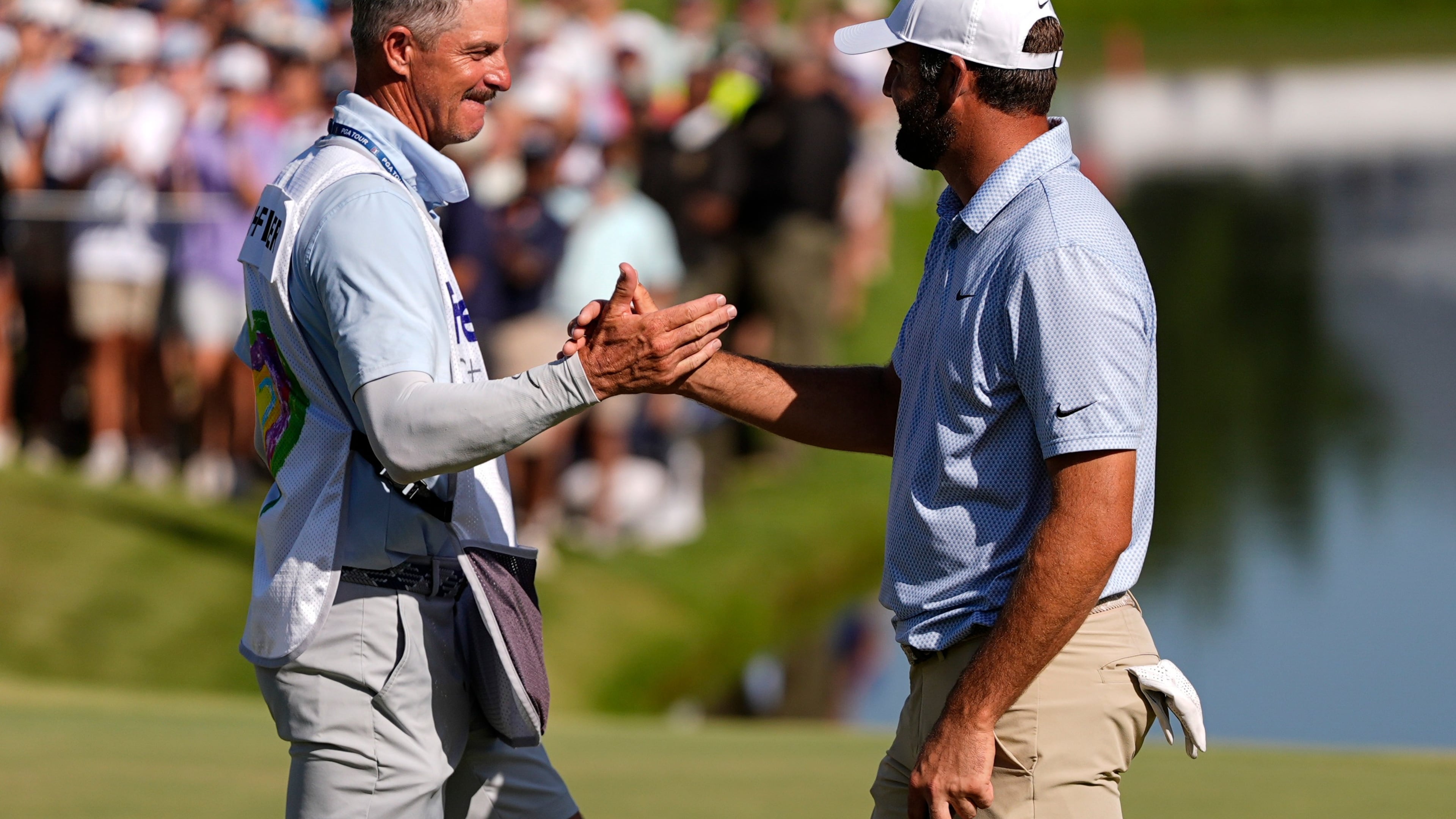 Scottie Scheffler celebrates winning on the 18th green the final round of the St. Jude Championship golf tournament, Sunday, Aug. 16, 2026, in Memphis, Tenn. (AP Photo/George Walker IV)