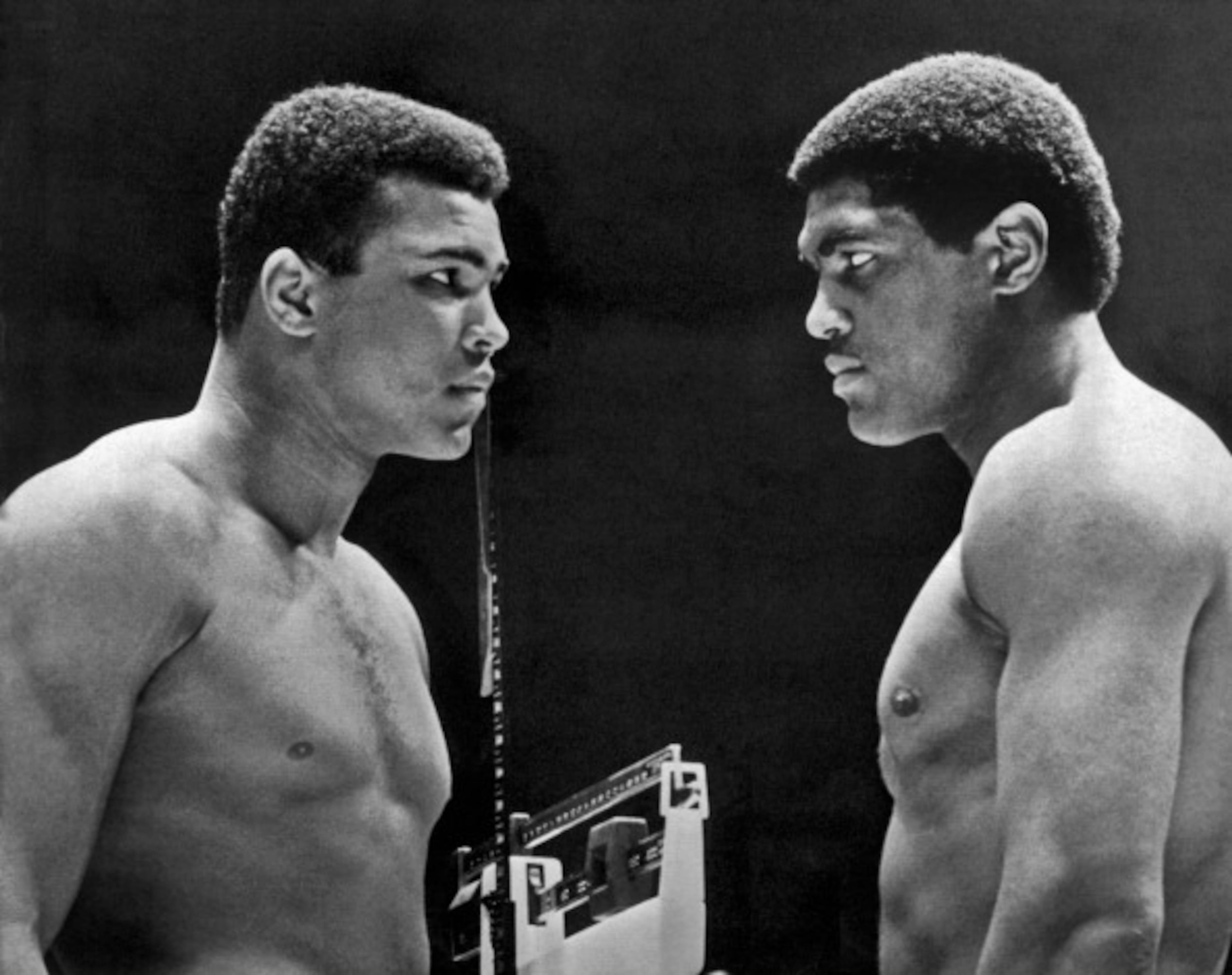 Heavyweight champion Cassius Clay (left) focuses his whammy eye on challenger Ernie Terrell during the weigh in for the title fight, Houston, Texas, February 6, 1967. (Photo by Underwood Archives/Getty Images)