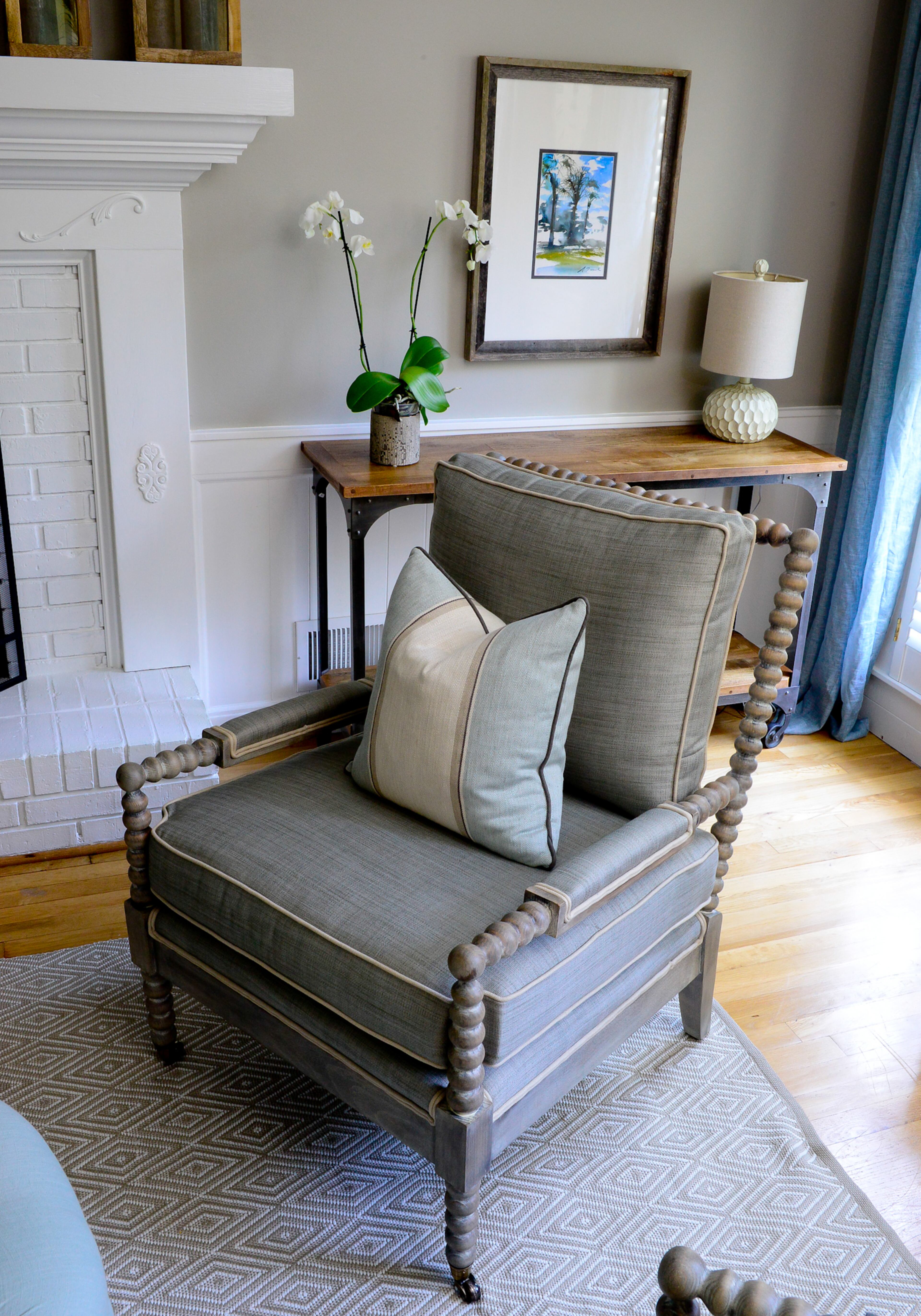 Upholstered spindle chairs from DR Kinkaid have the added benefit of being on casters (with custom pillows by Lauren Harris Interiors). The homeowners can change the configuration of the room depending on the number of guests.