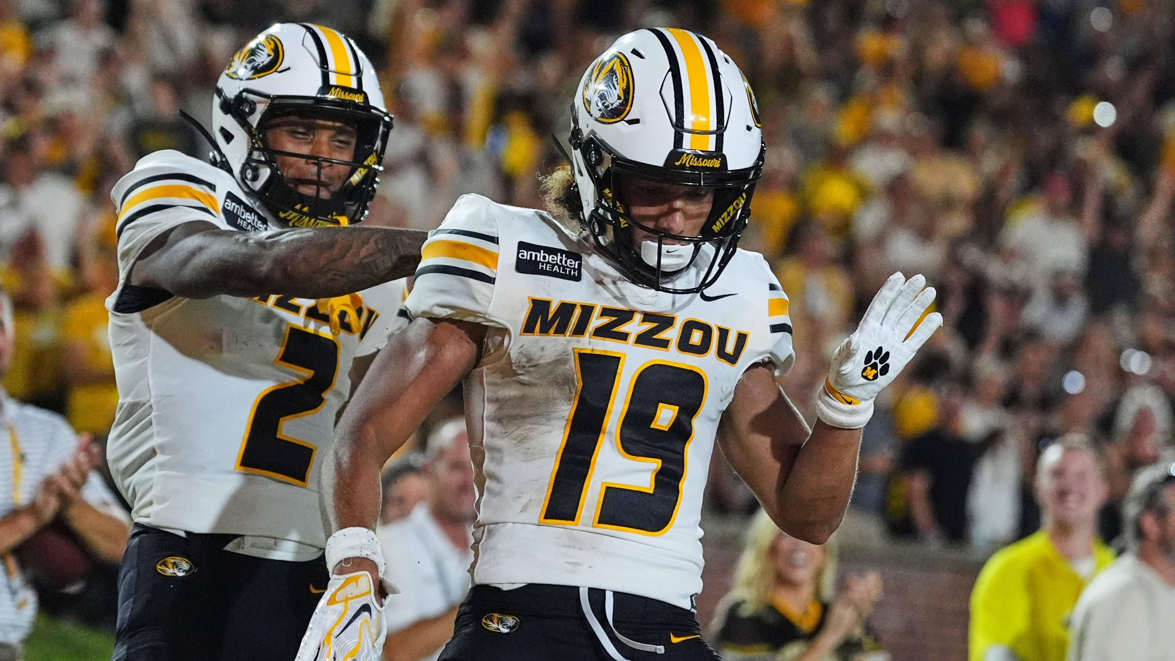 Missouri wide receiver Cayden Lee, right, is congratulated by Caleb Goodie Sr. (2) after scoring during the first half of an NCAA college football game against Arkansas-Pine Bluff Thursday, Sept. 3, 2026, in Columbia, Mo. (AP Photo/Jeff Roberson)