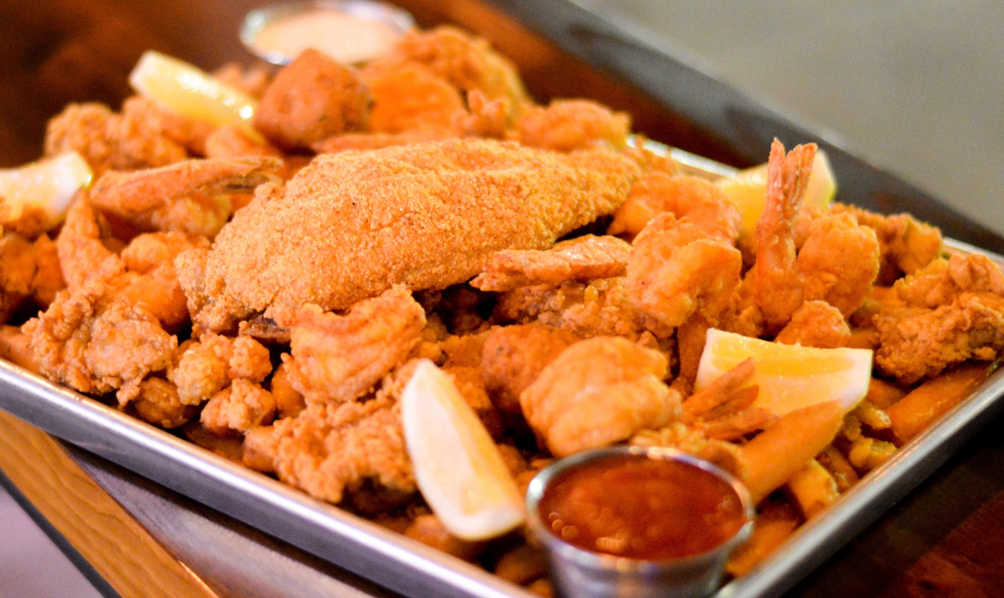 Farewell to the Heartstopper Fried Feast at Bon Ton which includes crawfish, oysters, shrimp, catfish, Cajun fries and hush puppies. (Henri Hollis/AJC)