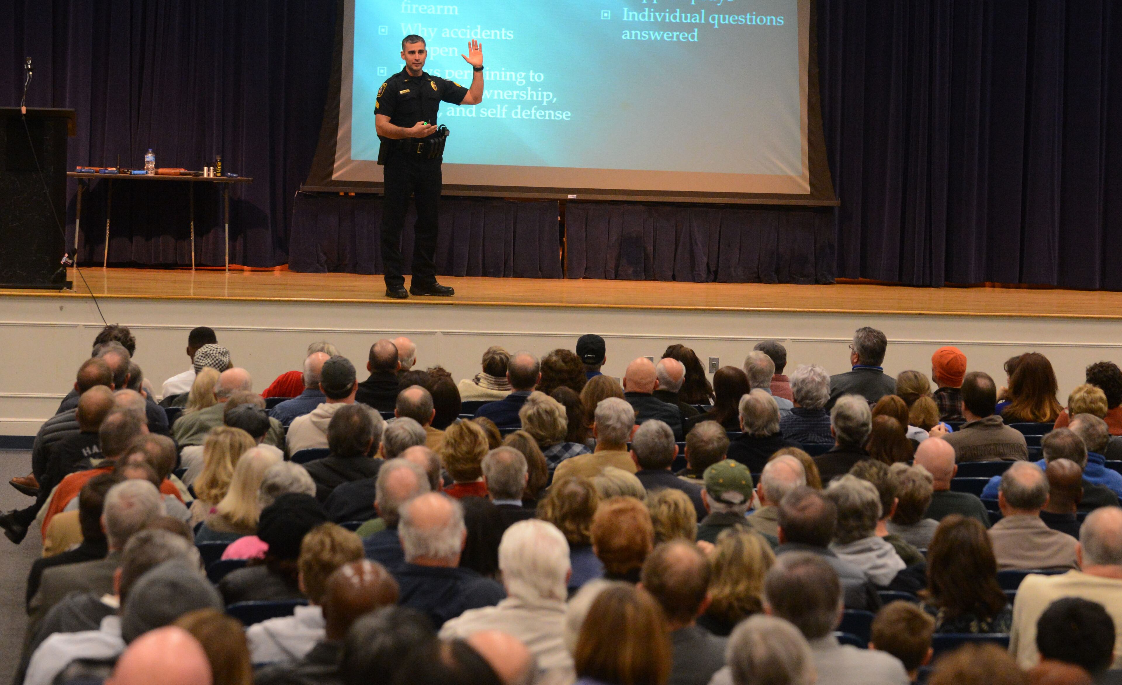 Marietta Police firearms instructor Sgt Jake King addresses a capacity crowd at the Marietta Police Department's gun safety course The class, normally held at City Hall, was moved to the auditorium at Marietta Middle School to accommodate the crowd.