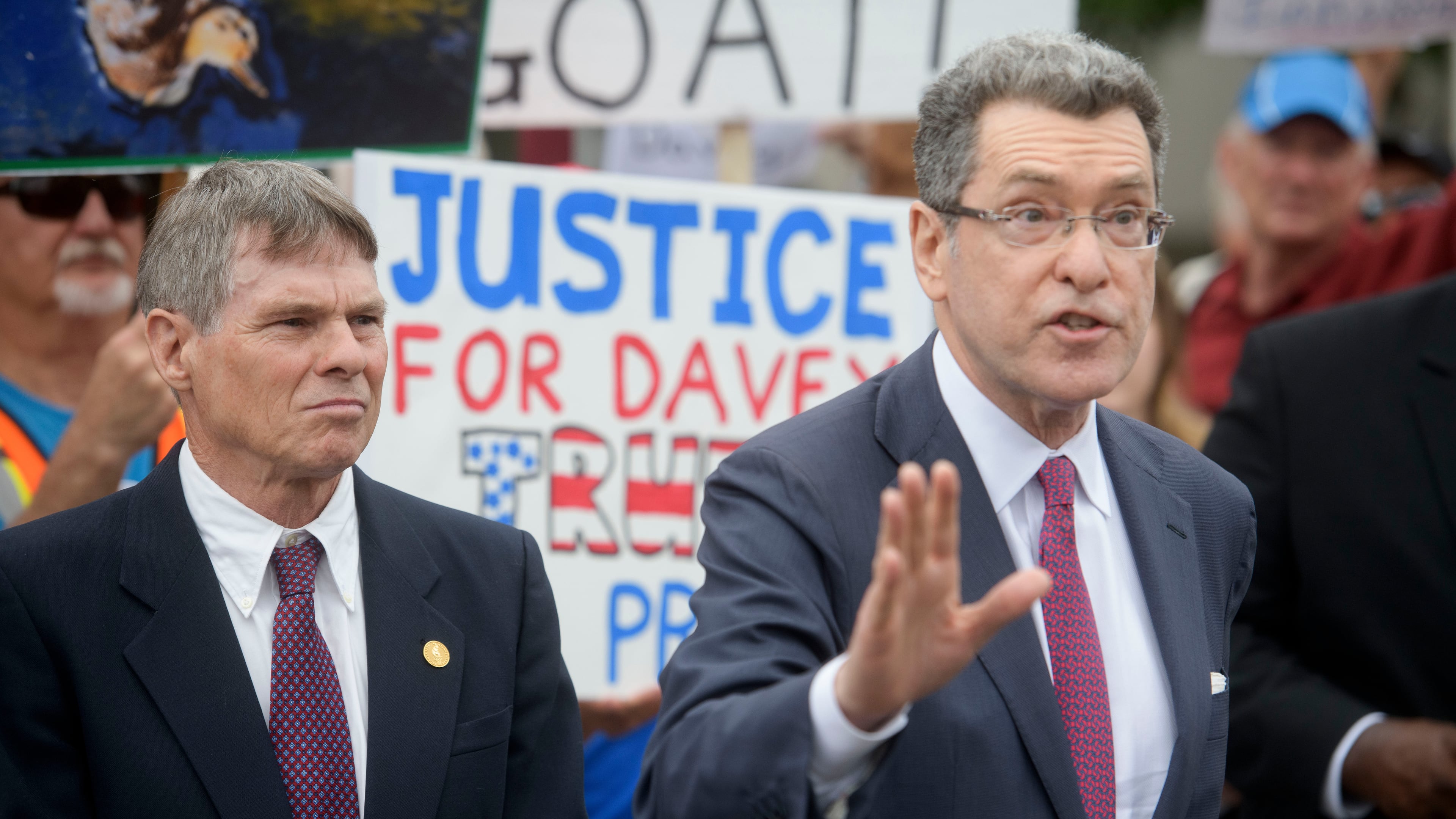Former Olympic canoeist David Hearn, left, listens as his attorney Norman Eisen, right, speaks after he pleaded not guilty to allegedly damaging the Lincoln Memorial Reflecting Pool, Thursday, July 9, 2026, in Washington. (AP Photo/Rod Lamkey, Jr.)