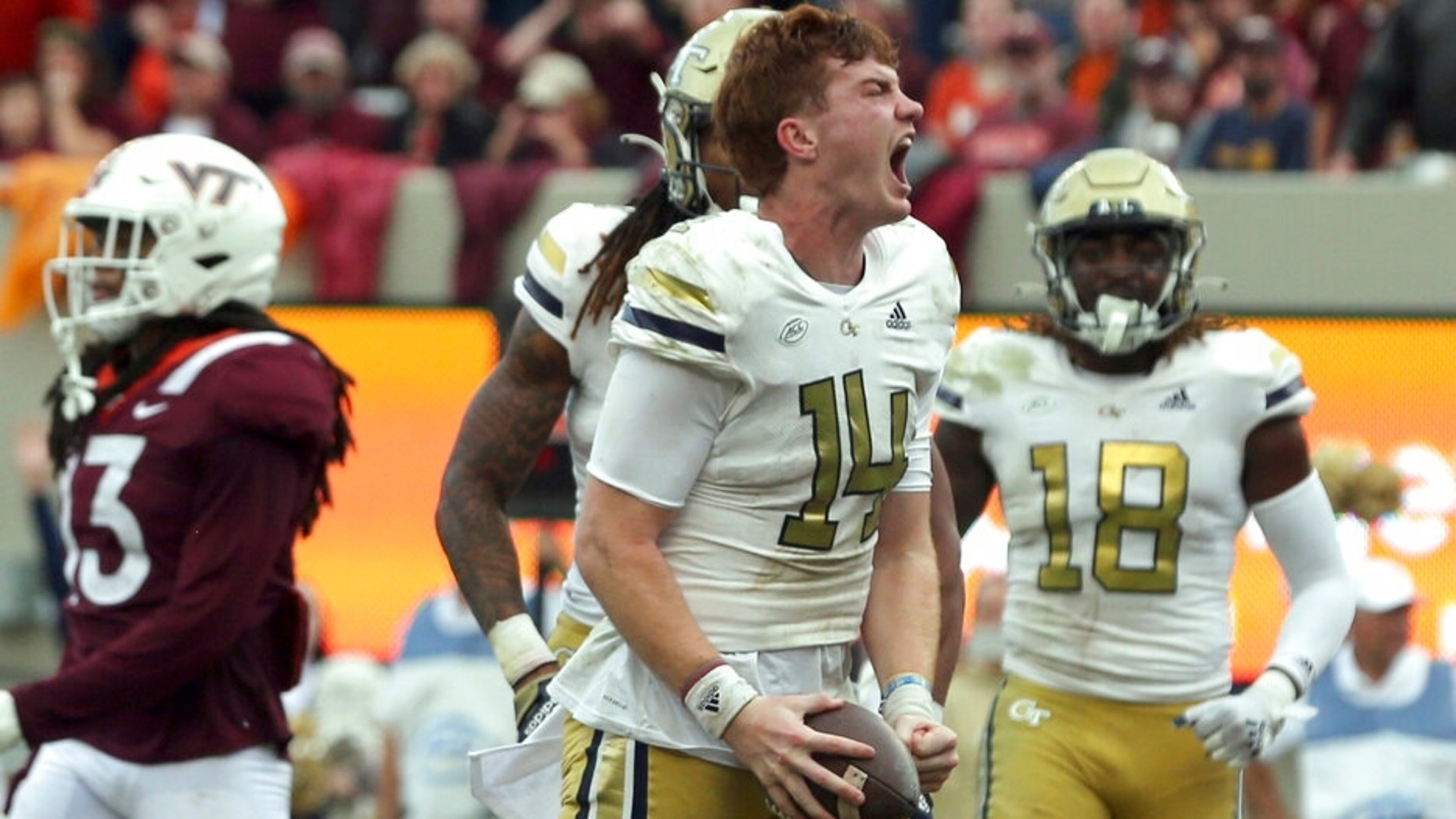 Georgia Tech quarterback Zach Pyron (14) celebrates a touchdown run in the second half of an NCAA college football game against Virginia Tech, Saturday, Nov. 5 2022, in Blacksburg, Va. (Matt Gentry/The Roanoke Times via AP)