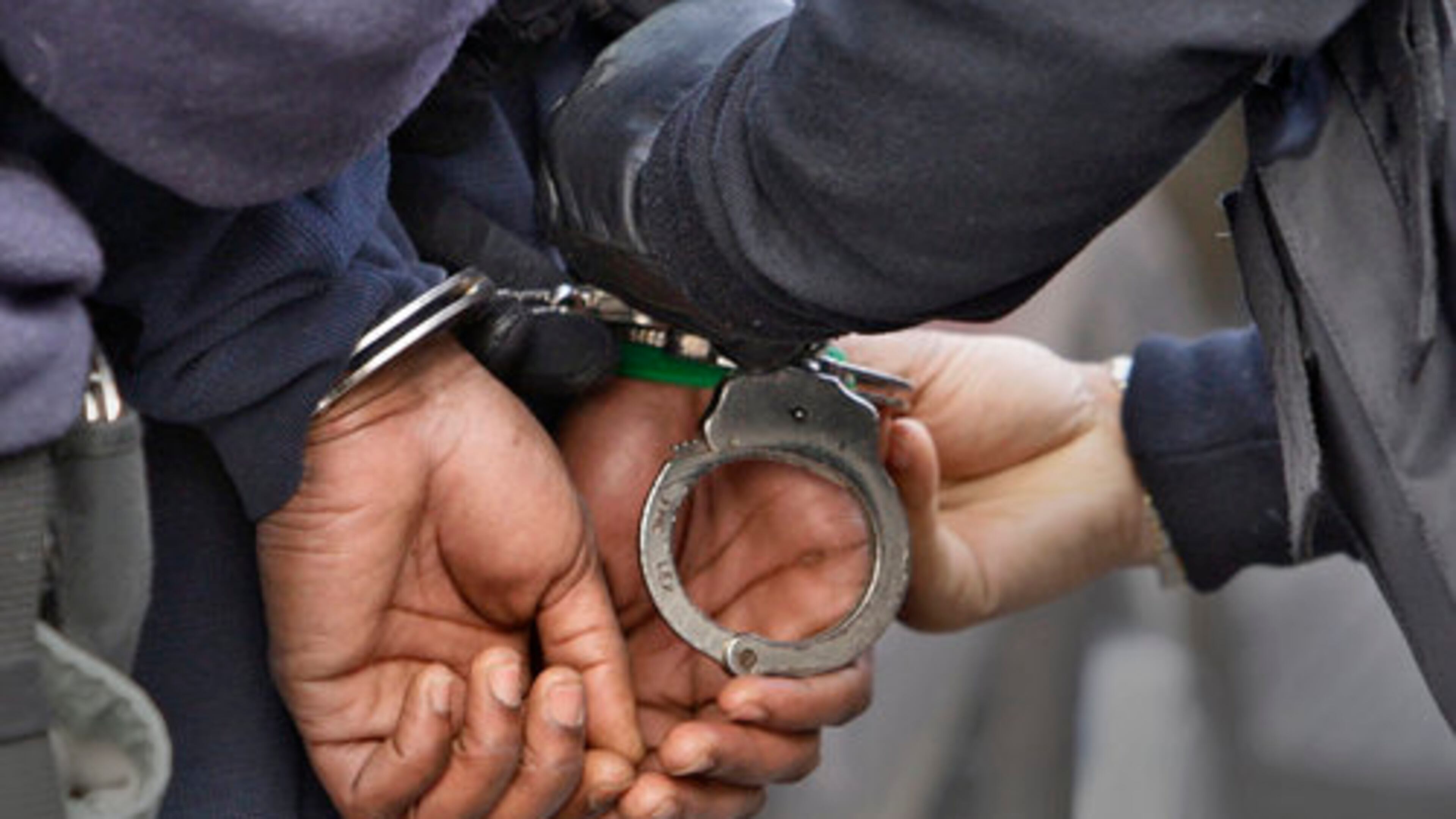 A NEW STYLE OF BLING--One of two suspects that US Marshals from the Southeast Regional Fugitive Task Force and the APD Gang Task Force arrested in a raid on an apartment complex on Thomasville Blvd. in Southeast Atlanta as part of operation Zero Deep Monday, March 7, 2011. Starting Monday morning, the APD and US Marshals office jointly conducted a 3-day roundup of suspected Atlanta area gang members.