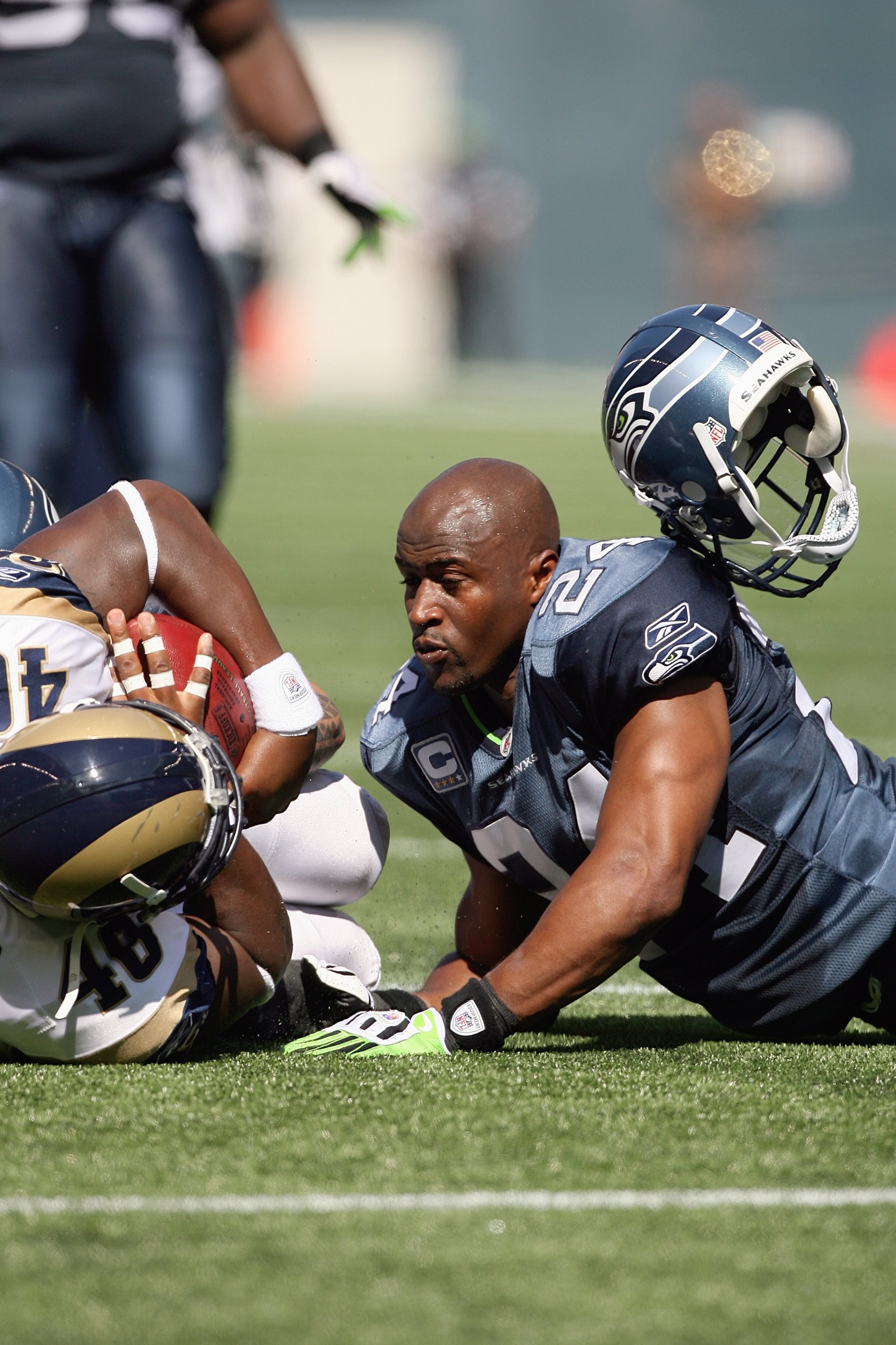 Deon Grant, 1996, Josey HS; 176 games in NFL from 2001-11. Here, Grant loses his helmet while making a tackle against the Rams on Sept. 13, 2009 in Seattle. (Photo by Otto Greule Jr./Getty Images)