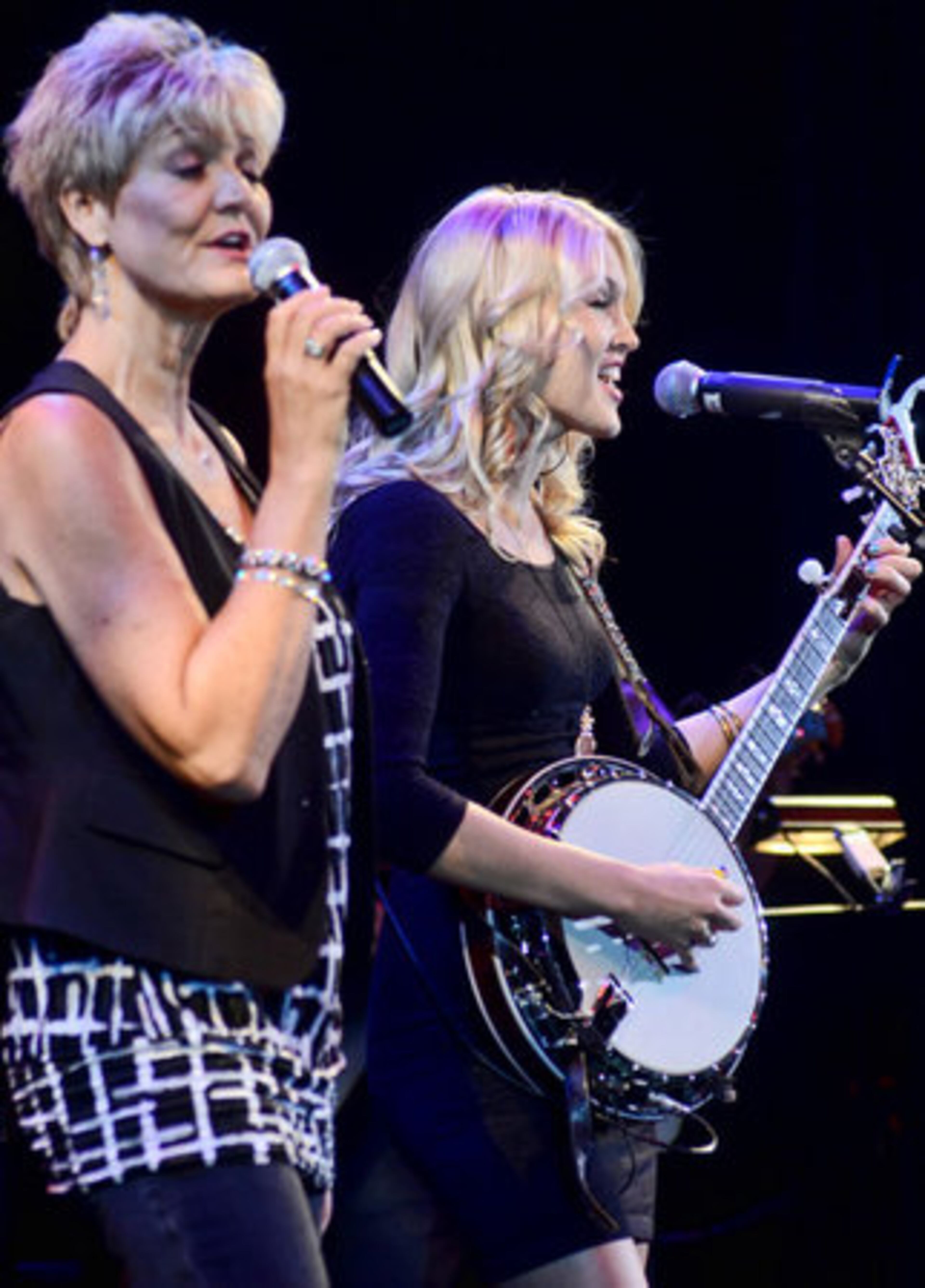 Debby Campbell-Cloyd, left, and Ashley Campbell sing together during a performance with their father Glen Campbell at the IP Casino.