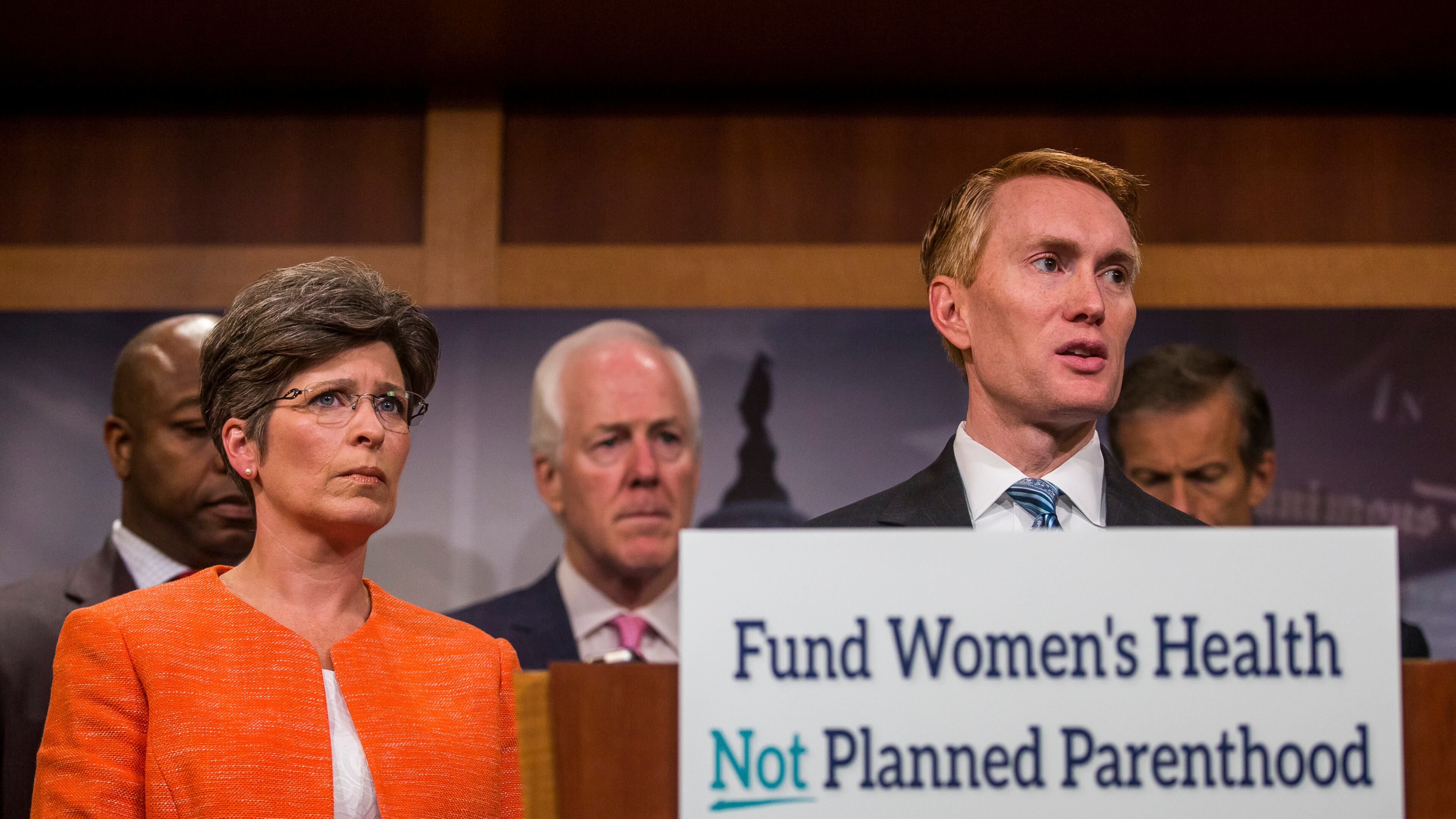 Sen. Joni Ernst, R-Iowa, and Sen. James Lankford, R-Okla., during a news conference about defunding Planned Parenthood on Capitol Hill, July 29. (Zach Gibson / The New York Times)