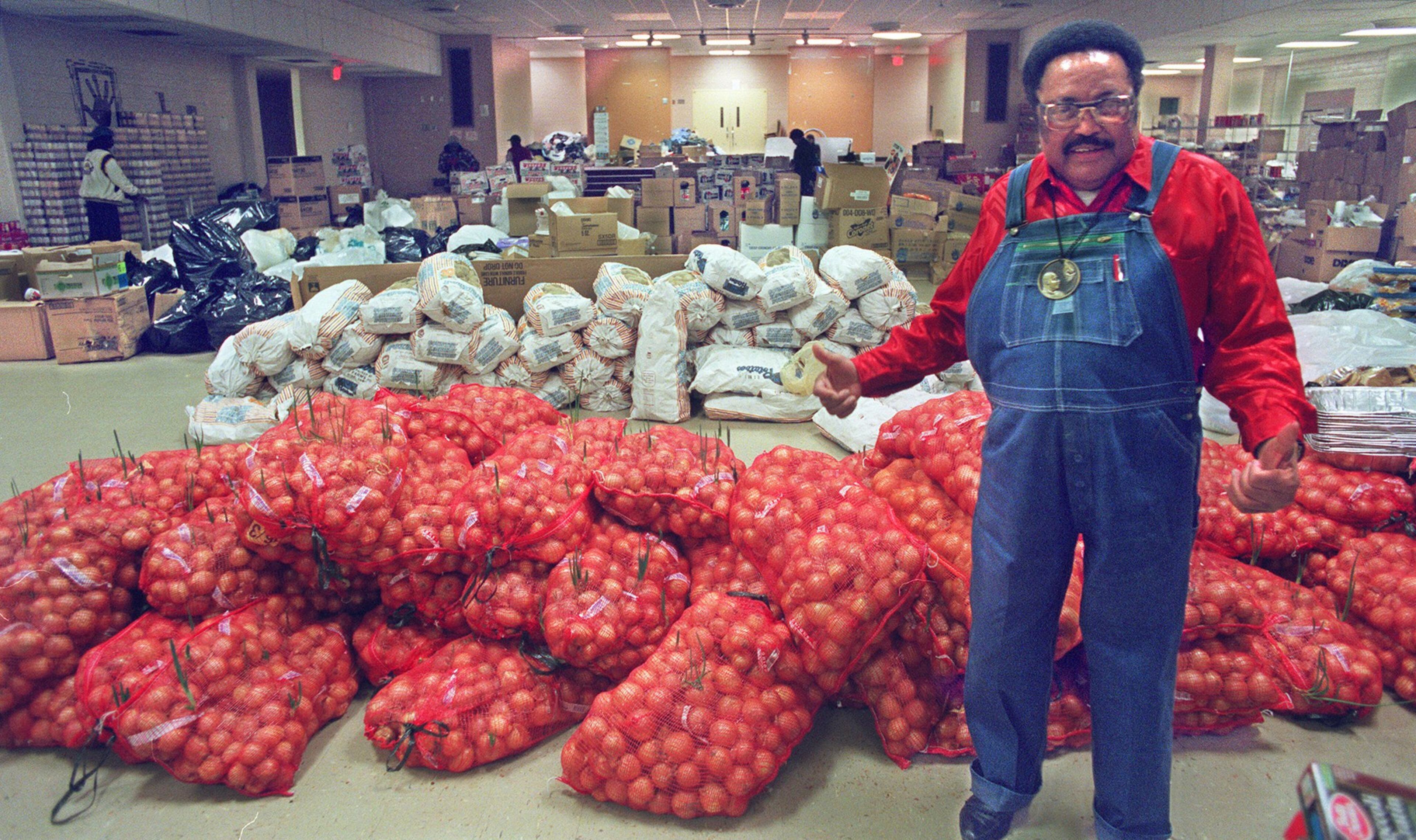 In his traditional red shirt and overalls, Hosea Williams fed thousands of Atlantans through his Hosea Feed the Hungry and Homeless program. The always colorful Williams died in 2000. (AJC file photo / Nick Arroyo)