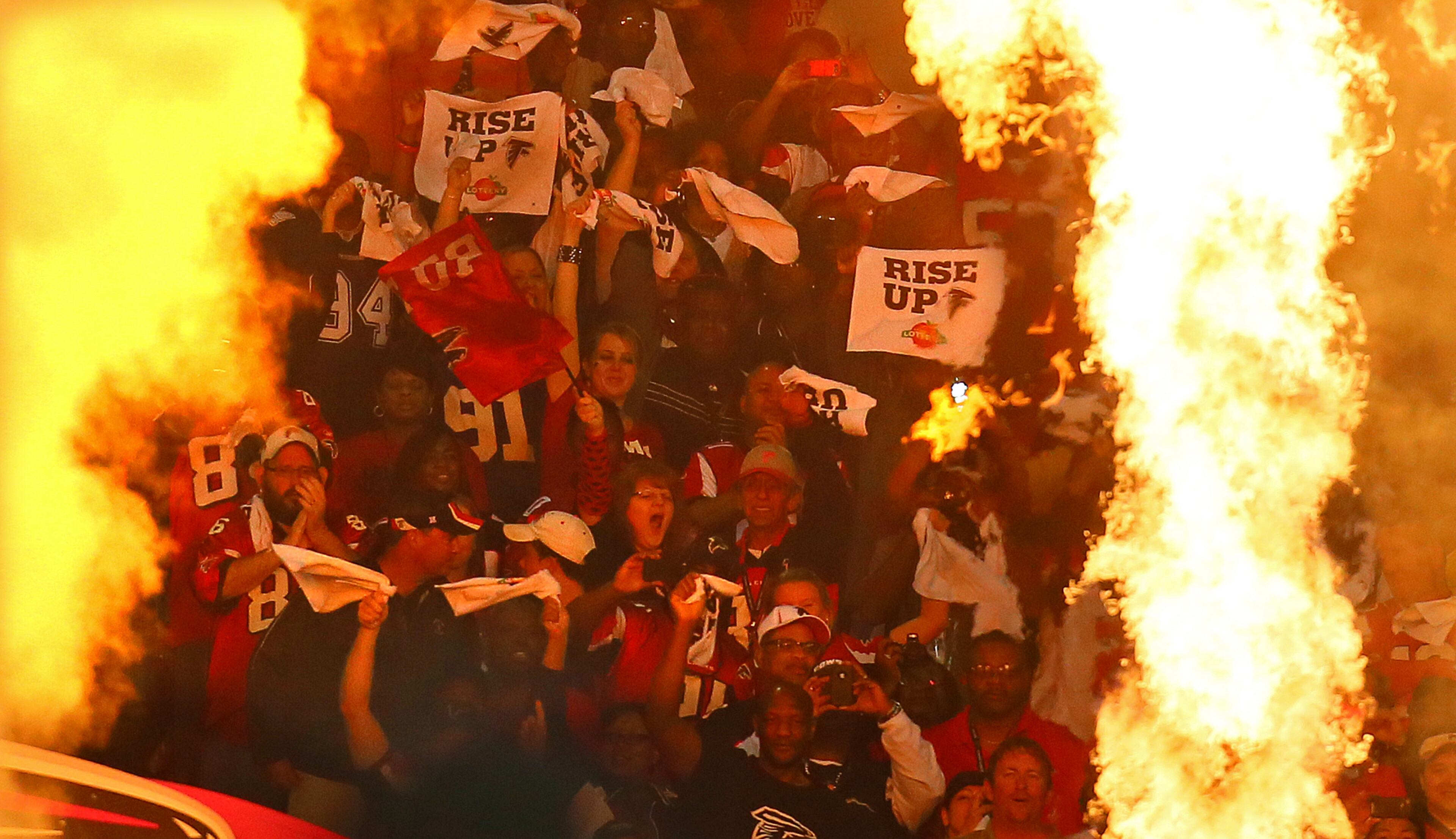 110412 ATLANTA: Falcons fans cheer their undefeated team as they take the field to play the Cowboys at the Georgia Dome in Atlanta on Sunday, Nov. 4, 2012. CURTIS COMPTON / CCOMPTON@AJC.COM