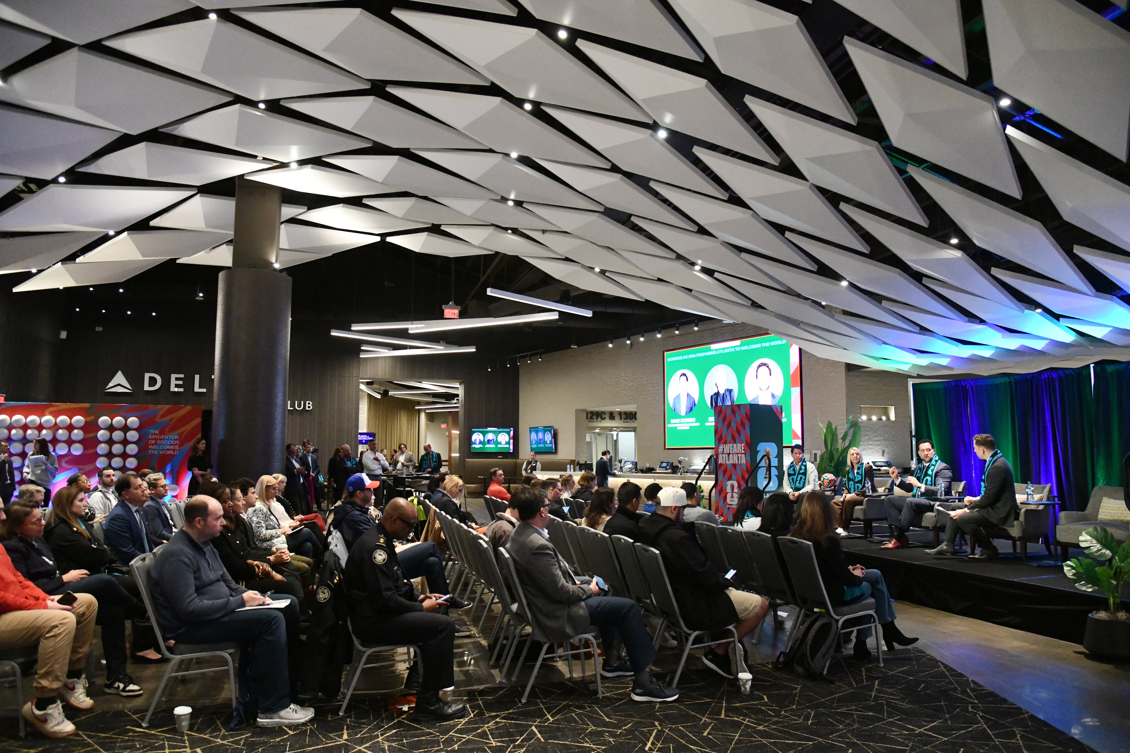 (From left) Dan Corso, president of the Atlanta Sports Council and a member of the host committee; Bev Carey, FIFA host city director for Atlanta; and Tim Zulawski, president of Arthur M. Blank Sports and Entertainment, participate in a panel discussion moderated by sports broadcaster Kevin Egan at Mercedes-Benz Stadium, Thursday, March 12, 2026. (Hyosub Shin/AJC)