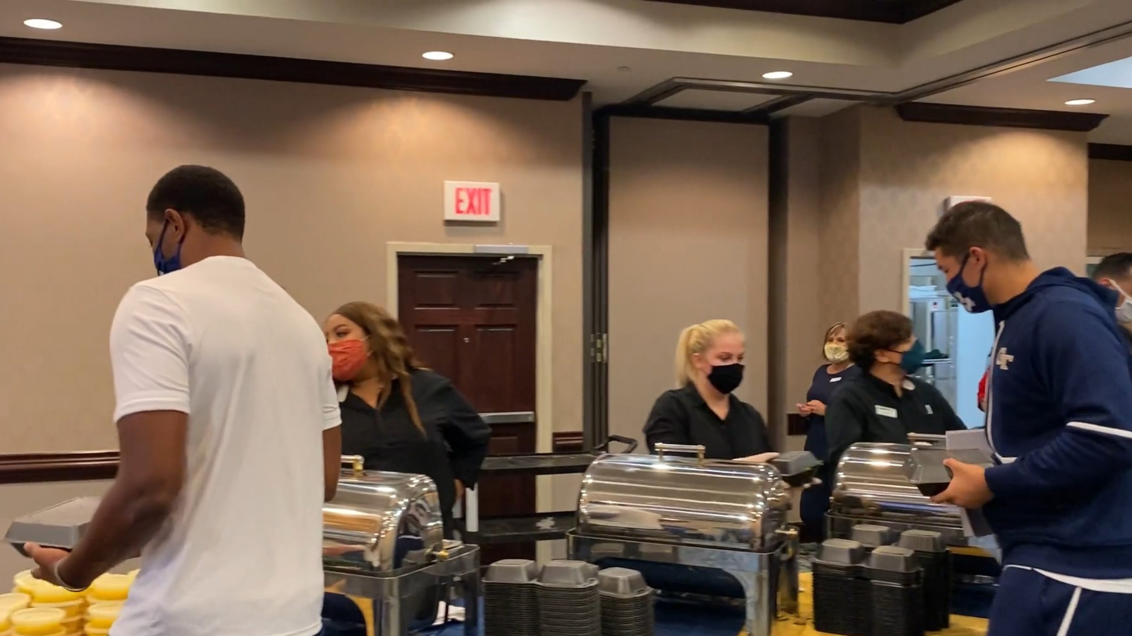 Georgia Tech players fill to-go cartons for their meal prior to their Sept. 12, 2020 game against Florida State in Tallahassee, Fla.