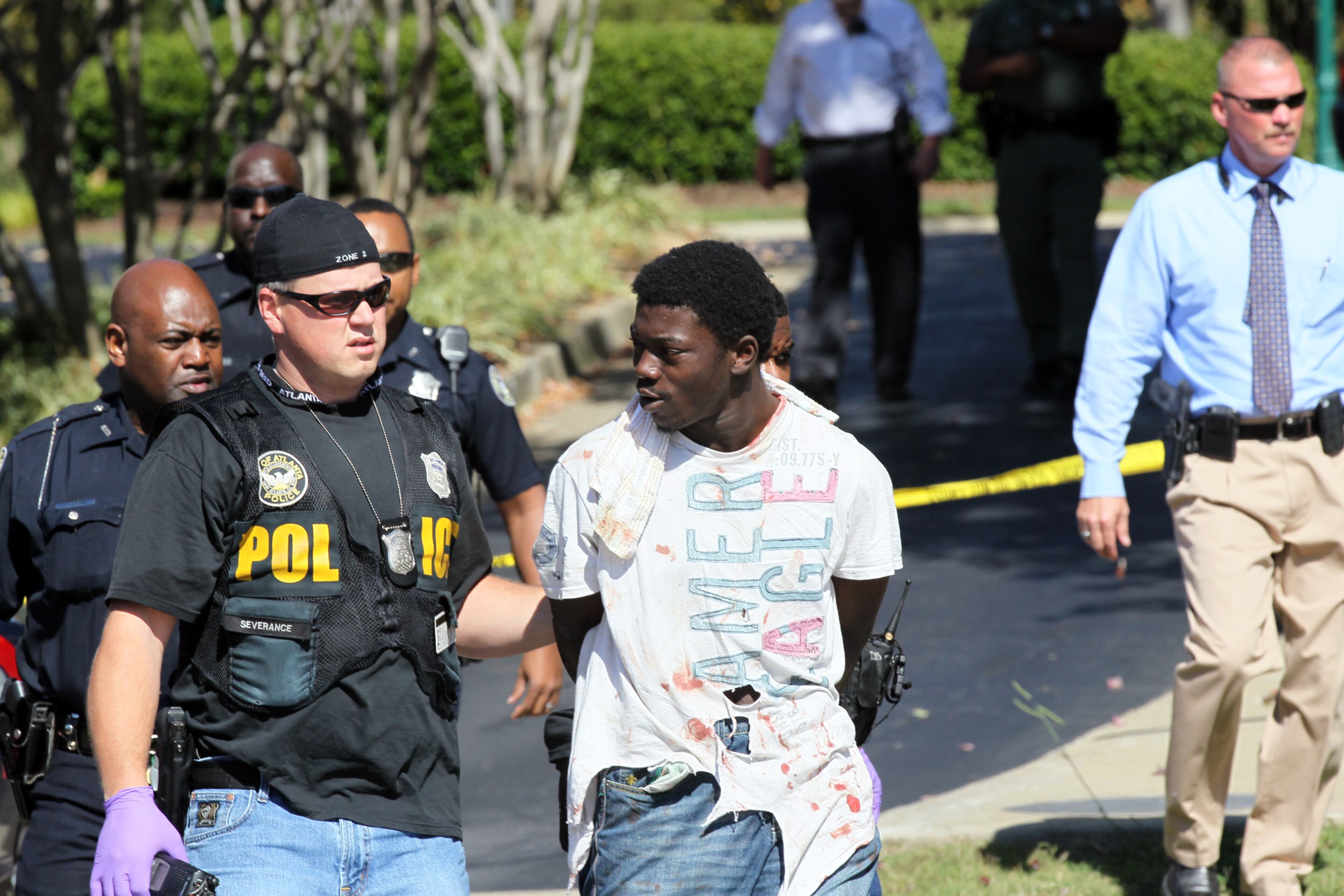 A burglary suspect surrendered to Atlanta police Thursday on the second floor of a Buckhead hotel that had been evacuated during a manhunt. The Towne Place Suites hotel at 800 Sidney Marcus Blvd. was evacuated just before the lunch hour as authorities, including a SWAT team, searched for the unidentified man.