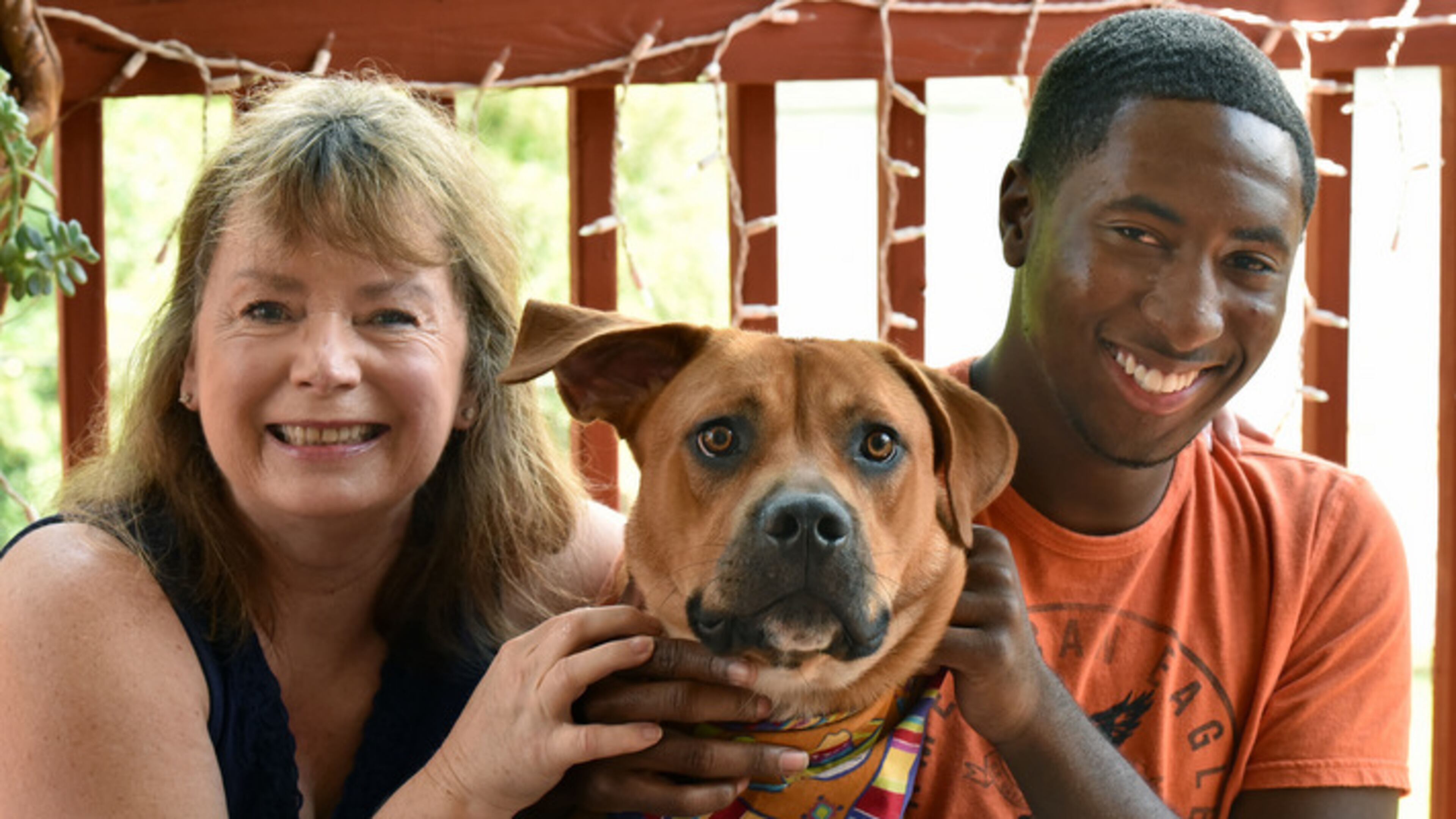 Vicki Van Der Hoek (left) and Leon Shields with Vicki's dog Bobby as Leon visits Vicki's home in Morrow on Thursday, August 27, 2015. HYOSUB SHIN / HSHIN@AJC.COM
