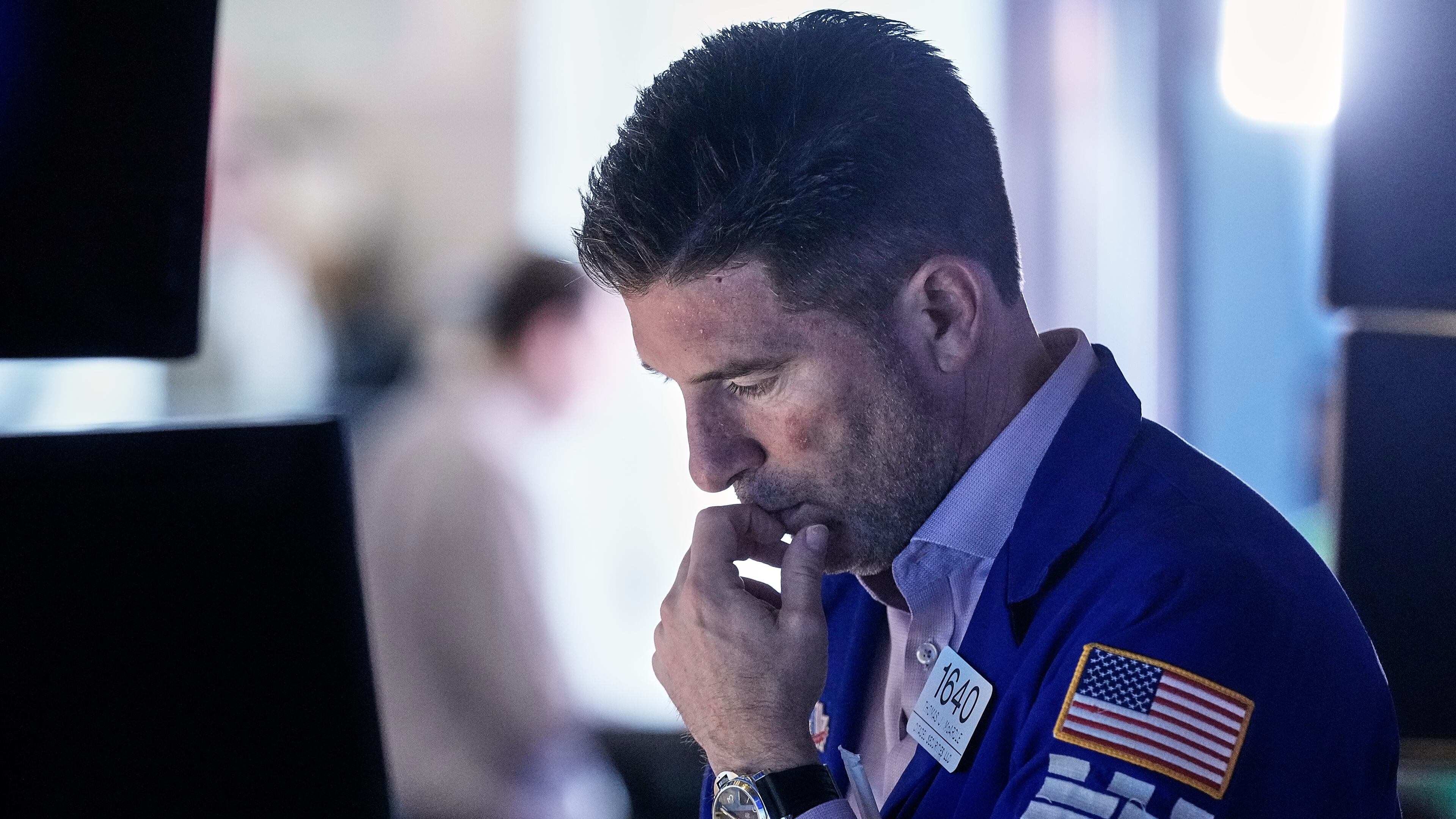 Specialist Thomas McArdle works at his post on the floor of the New York Stock Exchange, Friday, Feb. 20, 2026. (AP Photo/Richard Drew)