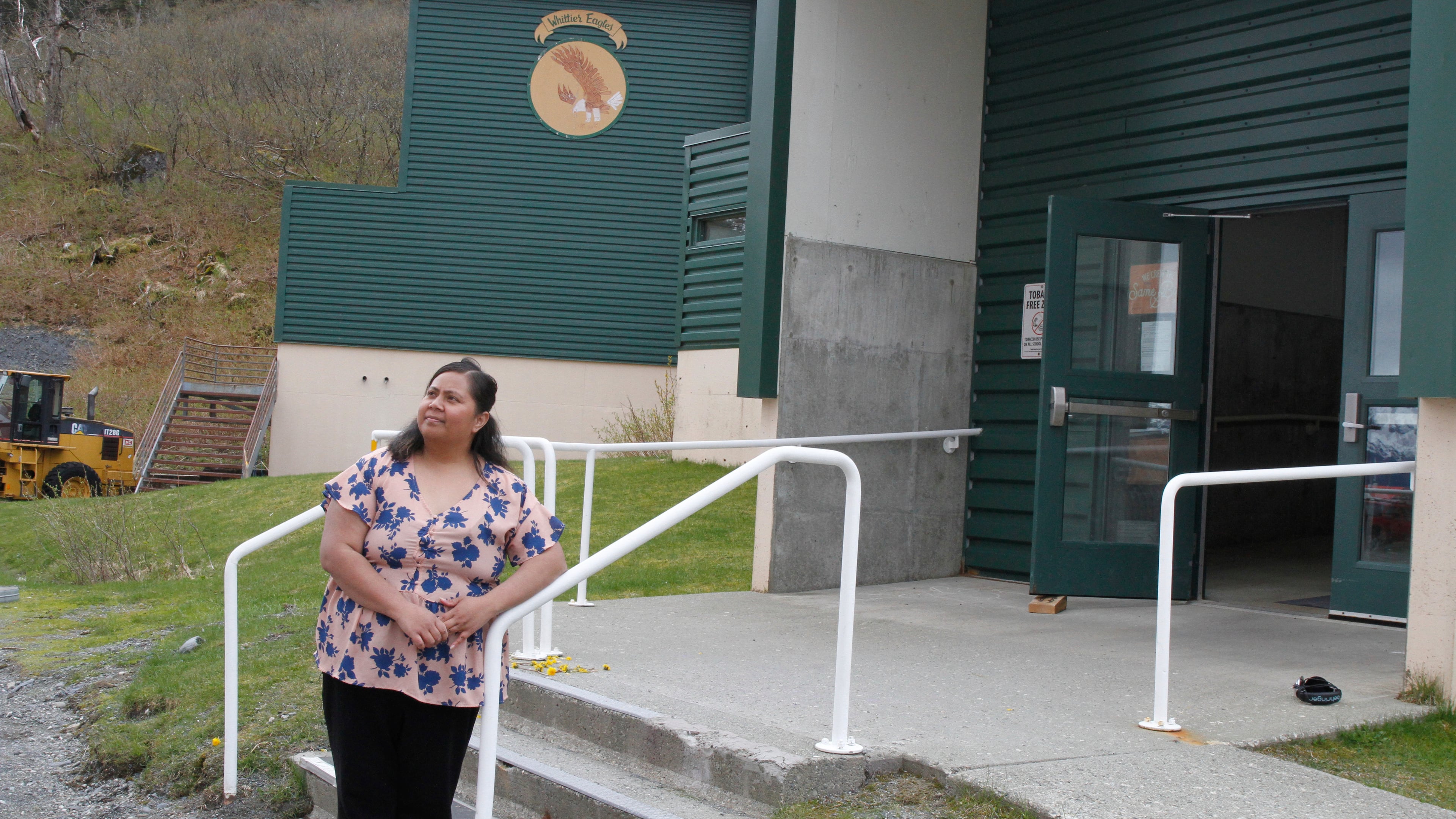 FILE - Tupe Smith poses for a photo outside the school in Whittier, Alaska, May 13, 2025. (AP Photo/Mark Thiessen, File)