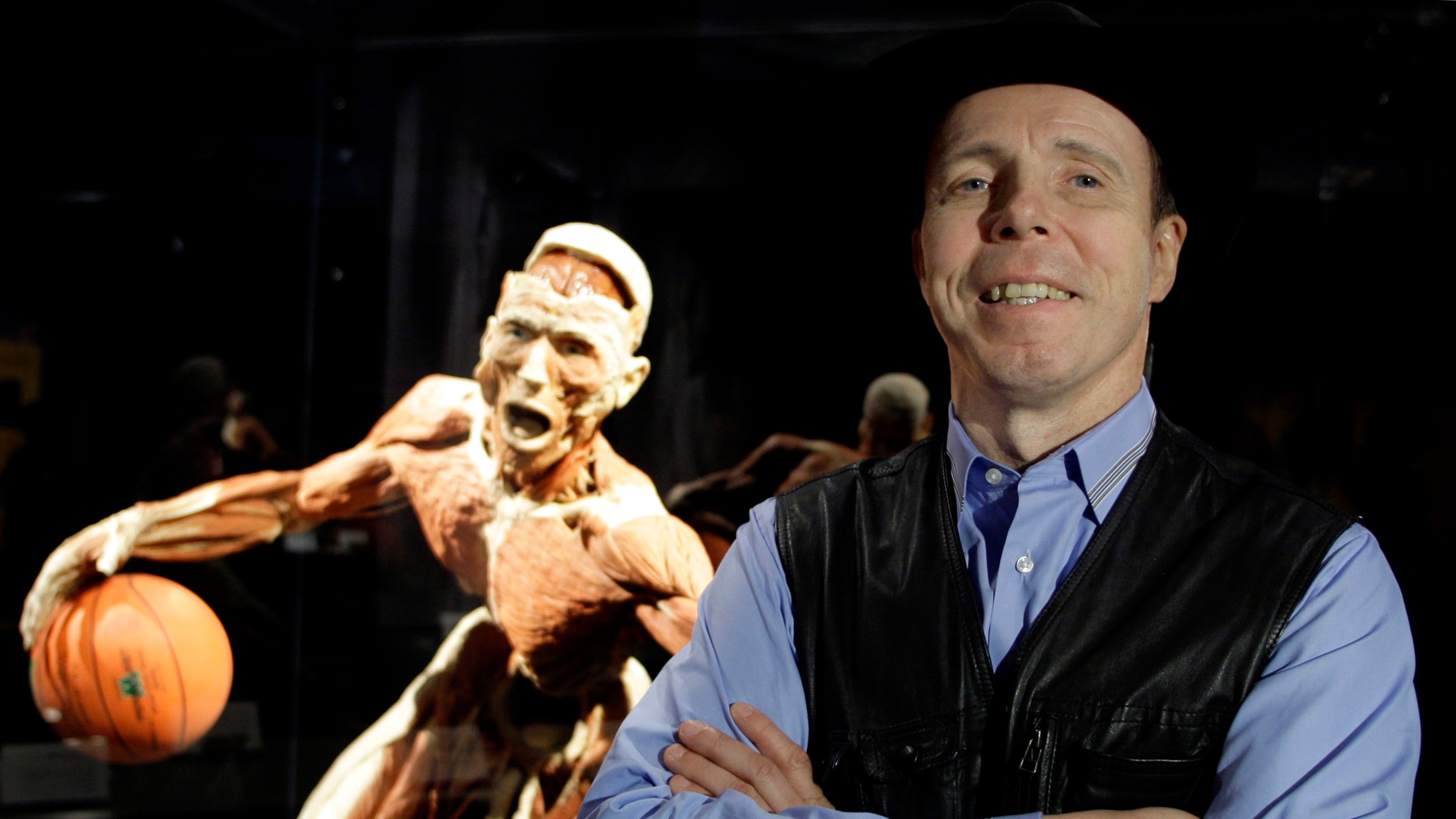 FILE - Doctor Gunther von Hagens, anatomist, inventor of and creator of Body Worlds The Original Exhibitions of Real Human Bodies known as Germany's 'Dr Death' , is seen in front of one of his works in Istanbul, Turkey, Friday, June 11, 2010. (AP Photo/Ibrahim Usta, file)