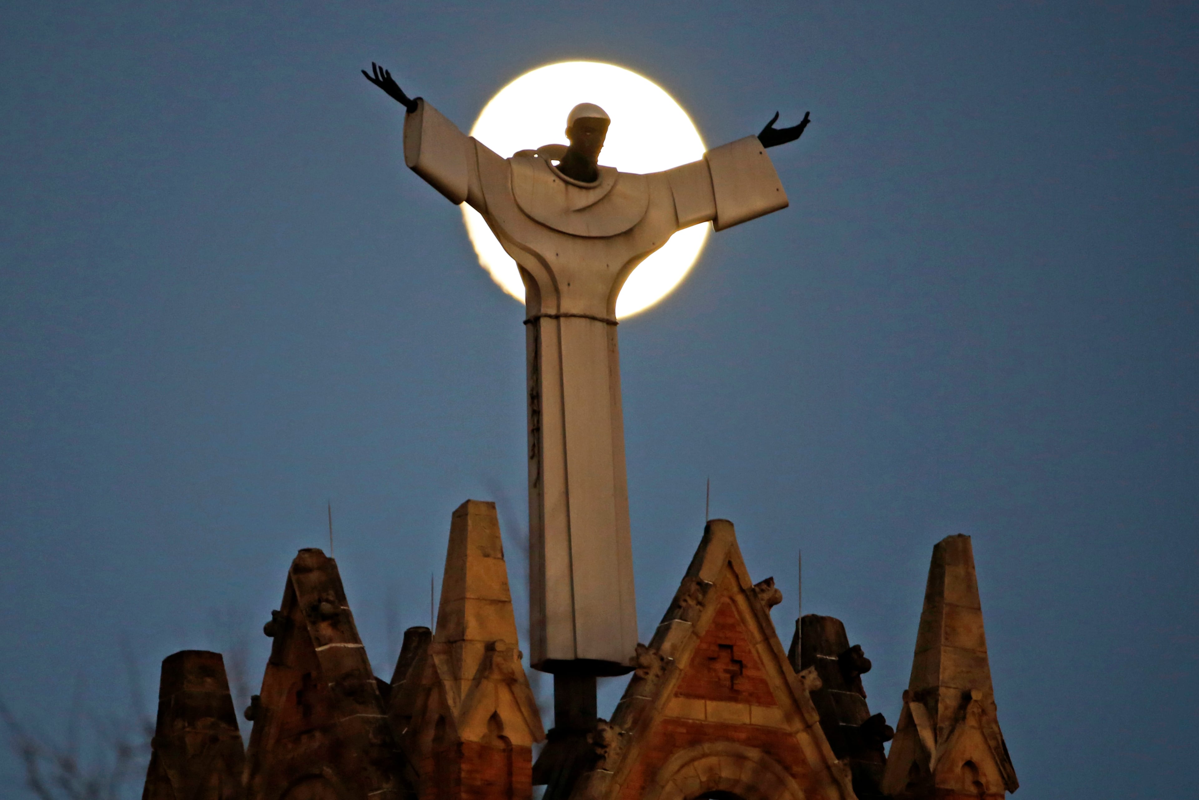 The moon rises behind St. Benedict The Moor Catholic church in Pittsburgh Saturday, Nov. 12, 2016. The Supermoon on November 14, 2016, will be the closest a Full Moon has been to Earth since January 26, 1948. The next time a Full Moon is even closer to Earth will be on November 25, 2034. (AP Photo/Gene J. Puskar)