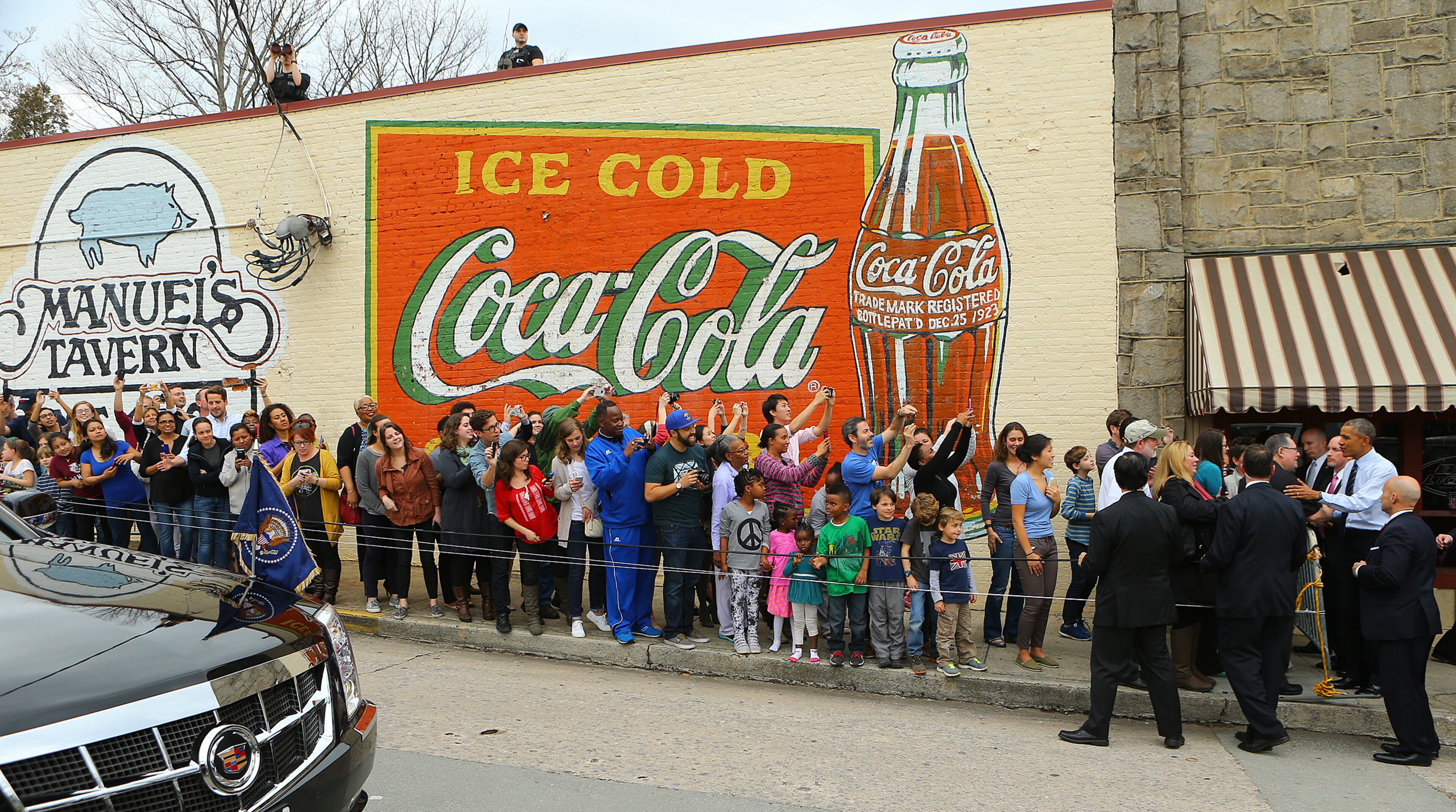 President Barack Obama (far right) works the crowd as he leaves Manuel's Tavern on Tuesday, March 10, 2015, in Atlanta. Curtis Compton / ccompton@ajc.com