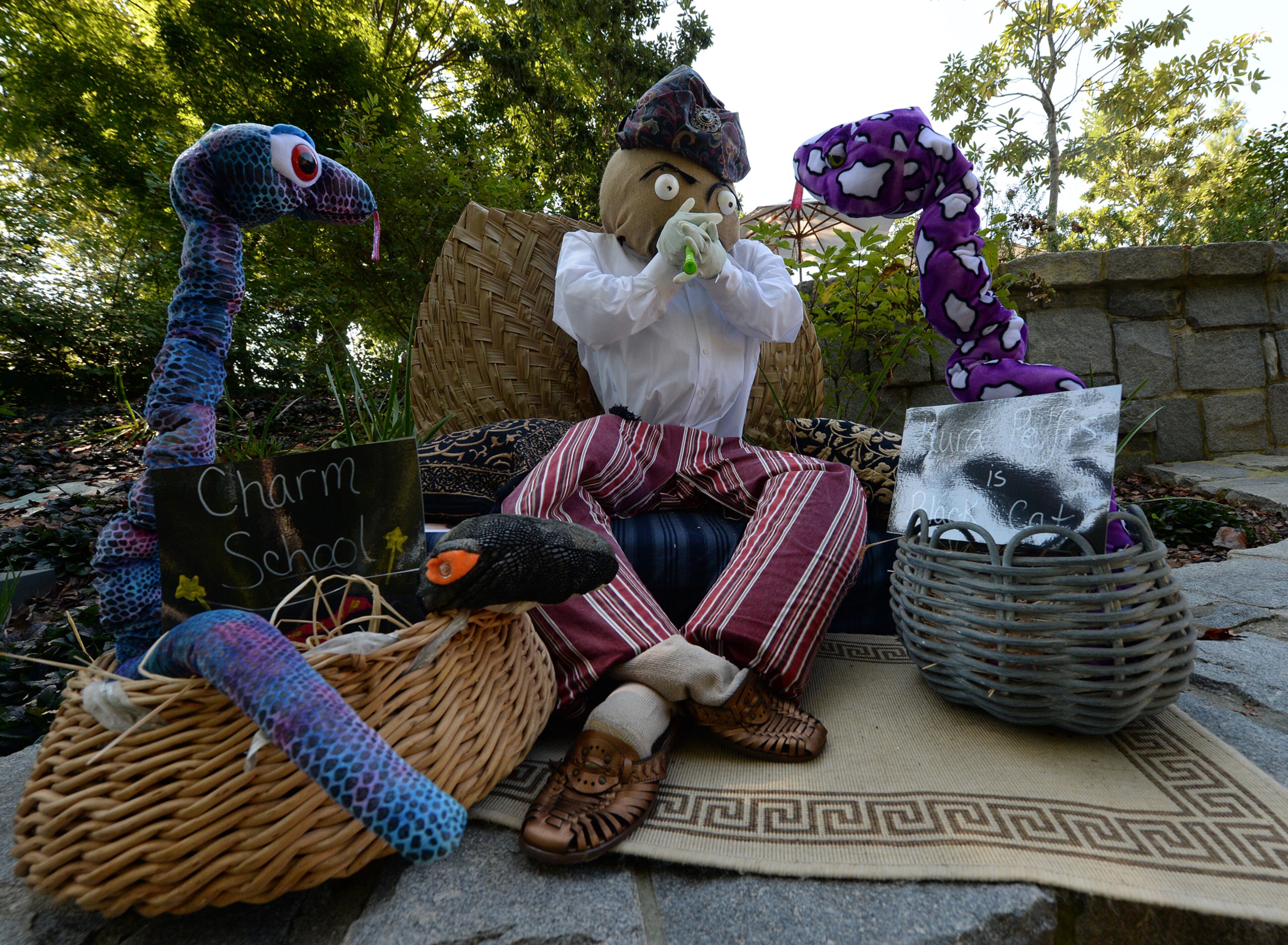 This snake charmer was one of the scrarecrows that were inspired by life plant creatures of Imaginary Worlds at the Atlanta Botanical Garden on Wednesday, October 2, 2013. This was one of over 125 scarecrows hand crafted by businesses, individuals, schools and organizations. The creative scarecrows share the stage with the larger than life plant creatures of Imaginary Worlds. JOHNNY CRAWFORD / JCRAWFORD@AJC.COM JOHNNY CRAWFORD / JCRAWFORD@AJC.COM