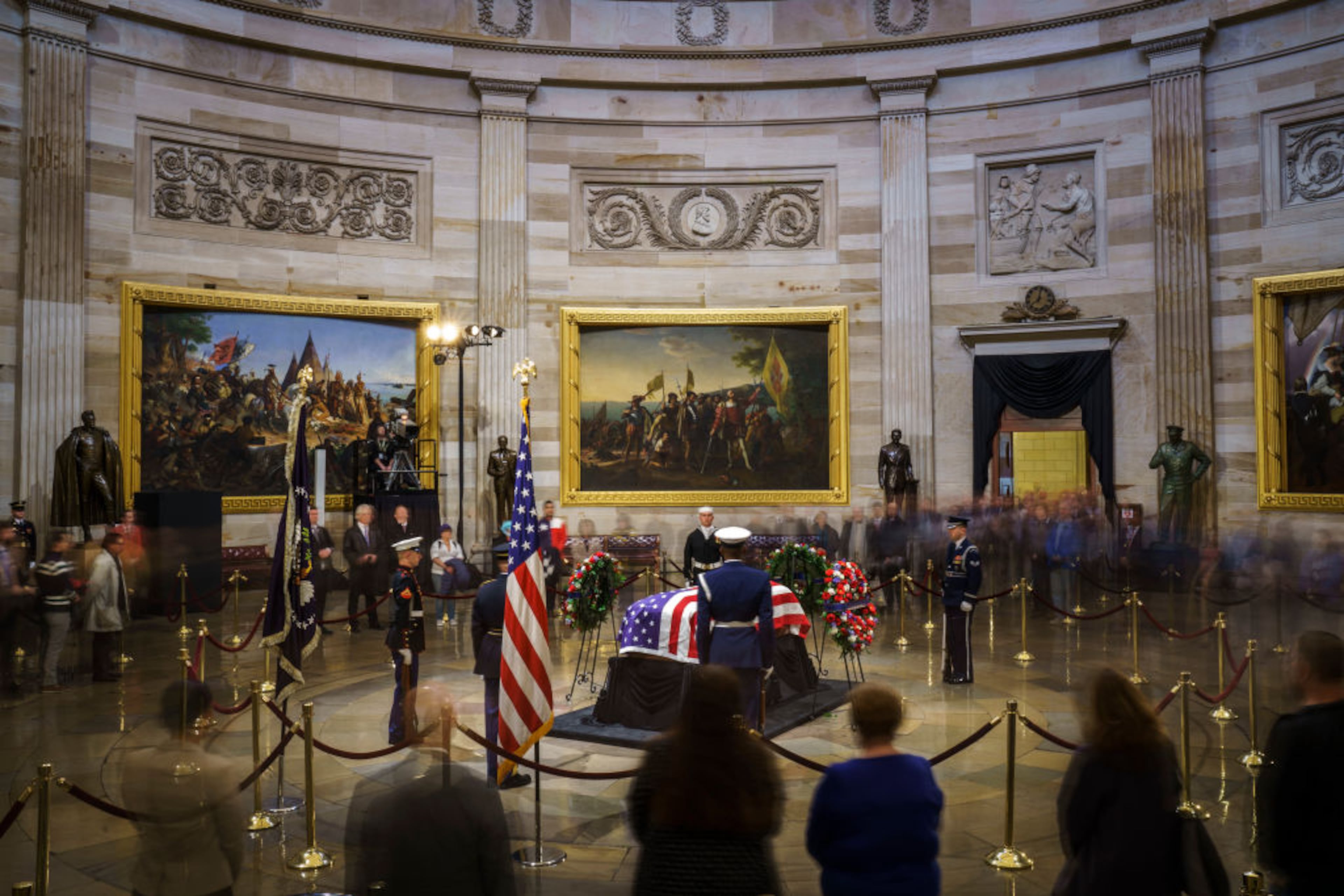 Members of the public file through the Capitol Rotunda to view the casket of the late former President George H.W. Bush as he lies in state, December 4, 2018 in Washington, DC. A WWII combat veteran, Bush served as a member of Congress from Texas, ambassador to the United Nations, director of the CIA, vice president and 41st president of the United States. Bush will lie in state in the U.S. Capitol Rotunda until Wednesday morning.