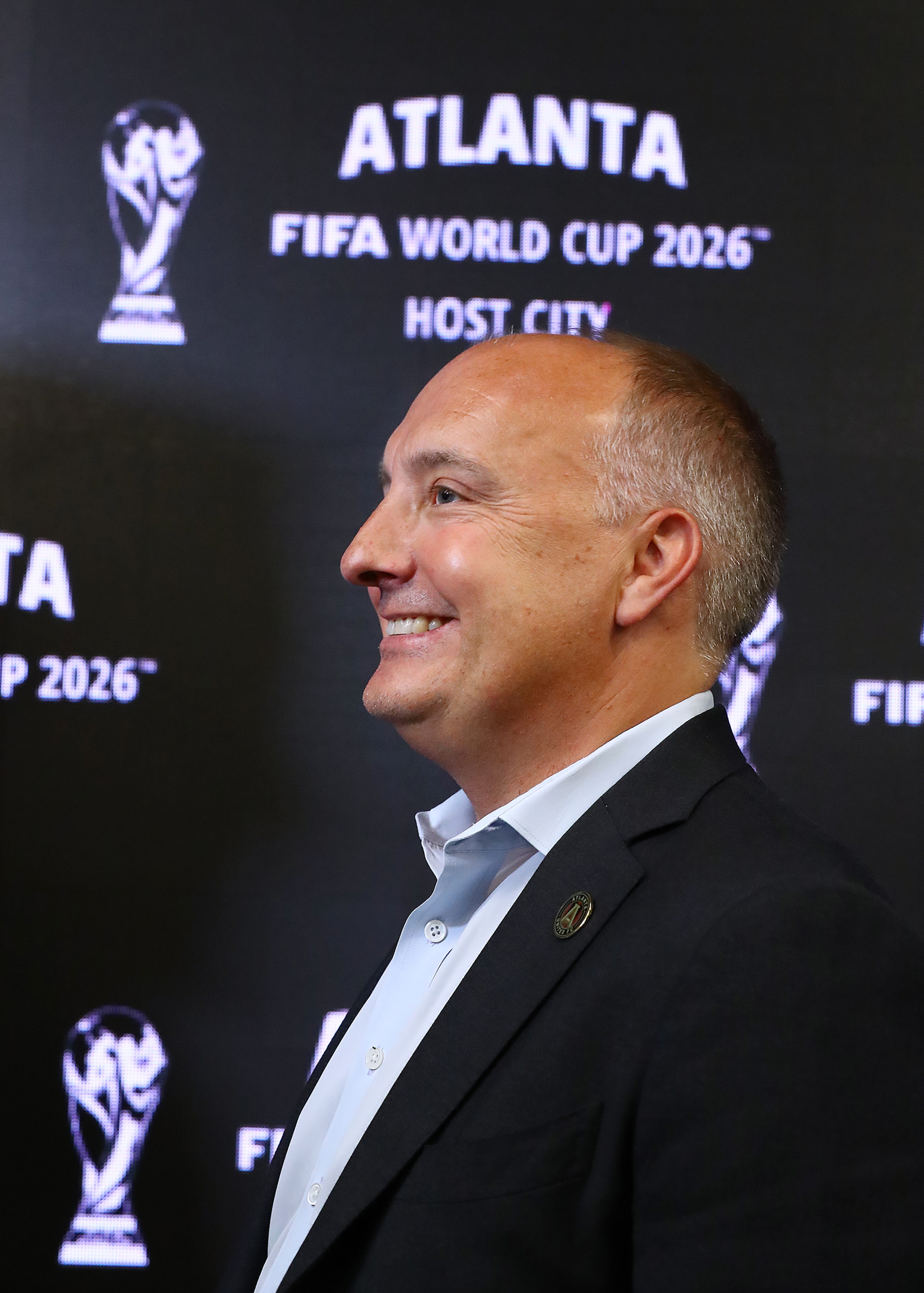 Darren Eales, President Atlanta United FC, is all smiles during the Host City announcement press conference for the 2026 World Cup at Mercedes-Benz Stadium on Thursday, June 16, 2022, in Atlanta. “Curtis Compton / Curtis.Compton@ajc.com”