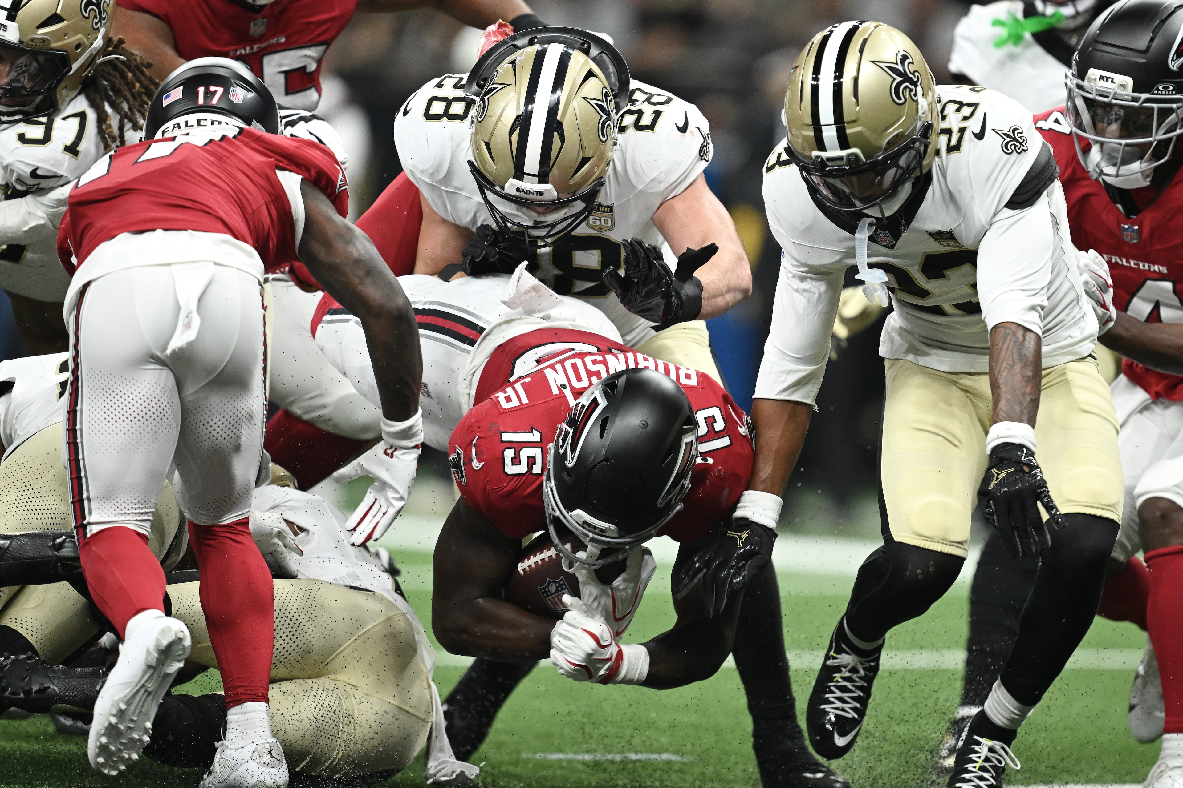 Atlanta Falcons running back Brian Robinson Jr. (bottom center) scores against the New Orleans Saints during the first half of an NFL football game in New Orleans, Monday, Oct. 5, 2026. (Ella Hall/AP)