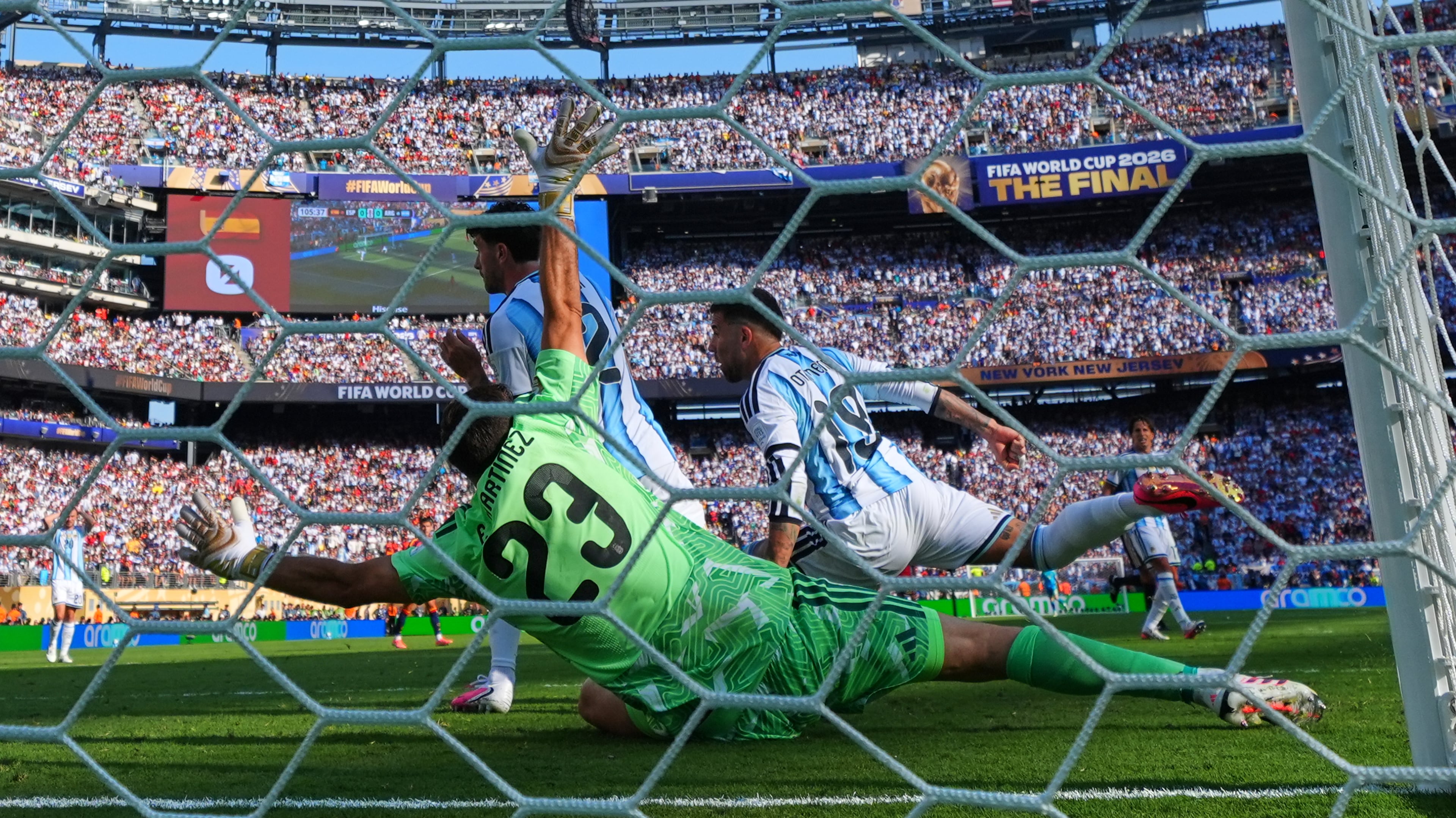 Spain's Ferran Torres (7) scores their first goal past Argentina goalkeeper Emiliano Martinez (23) during the World Cup final soccer match between Spain and Argentina in East Rutherford, N.J., near New York, Sunday, July 19, 2026. (AP Photo/Matt Slocum)